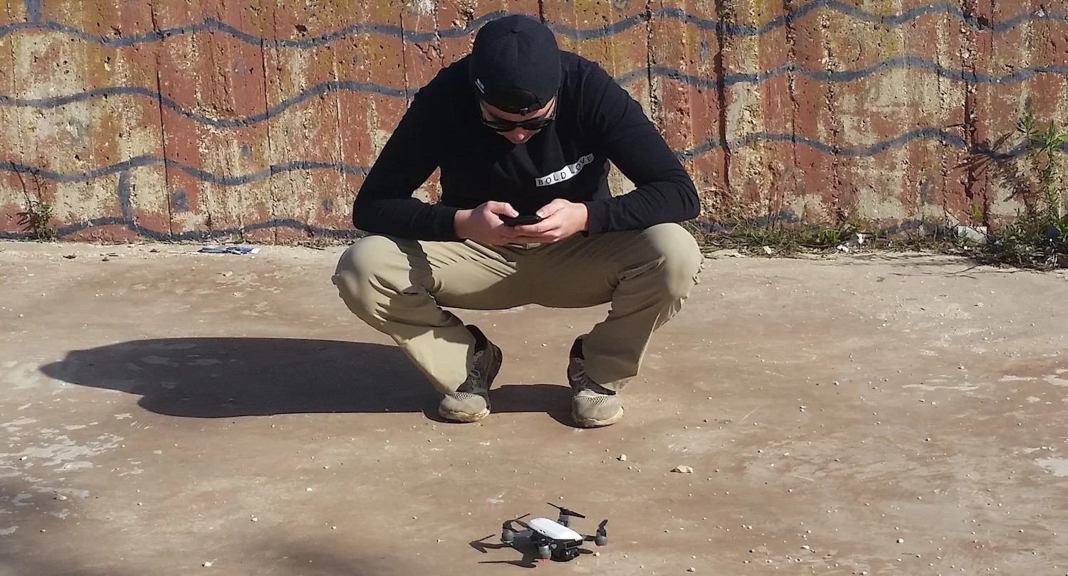 Cody, his phone, and his drone. Nazareth, Israel.