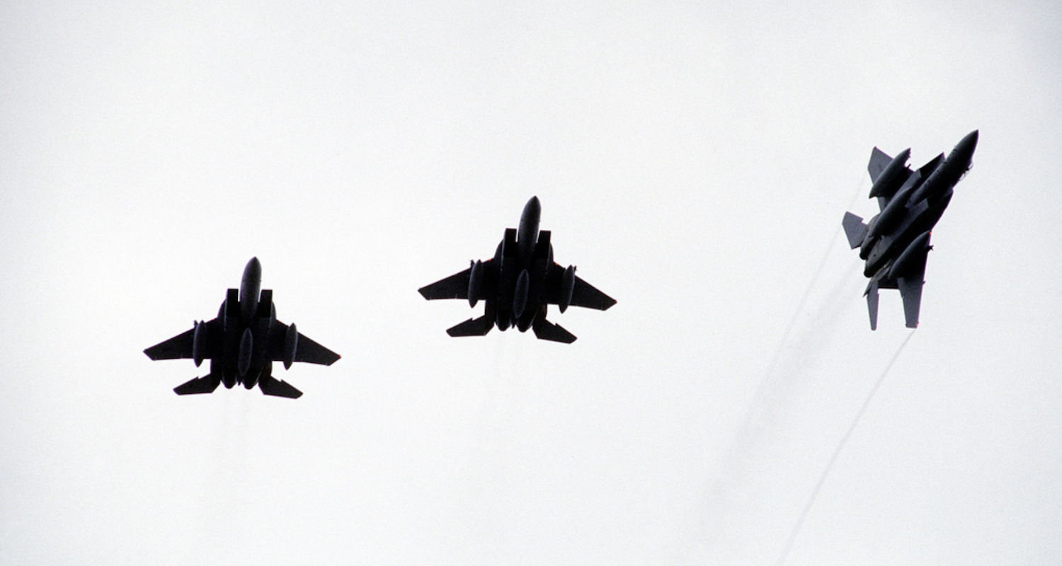 One slips out of formation. Image from https://nara.getarchive.net/media/an-f-15-eagle-aircraft-breaks-out-of-formation-with-two-other-f-15s-while-participating-56607d. Accessed 6/5/2019.
