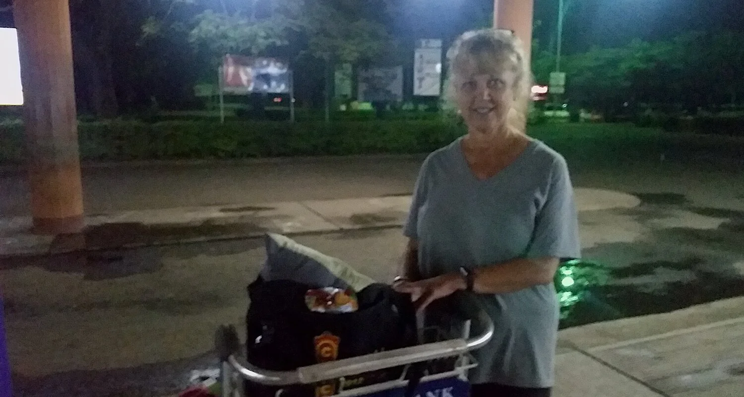 After more than 20 hours of travel, Vicki preferred to stand outside in the fresh air.