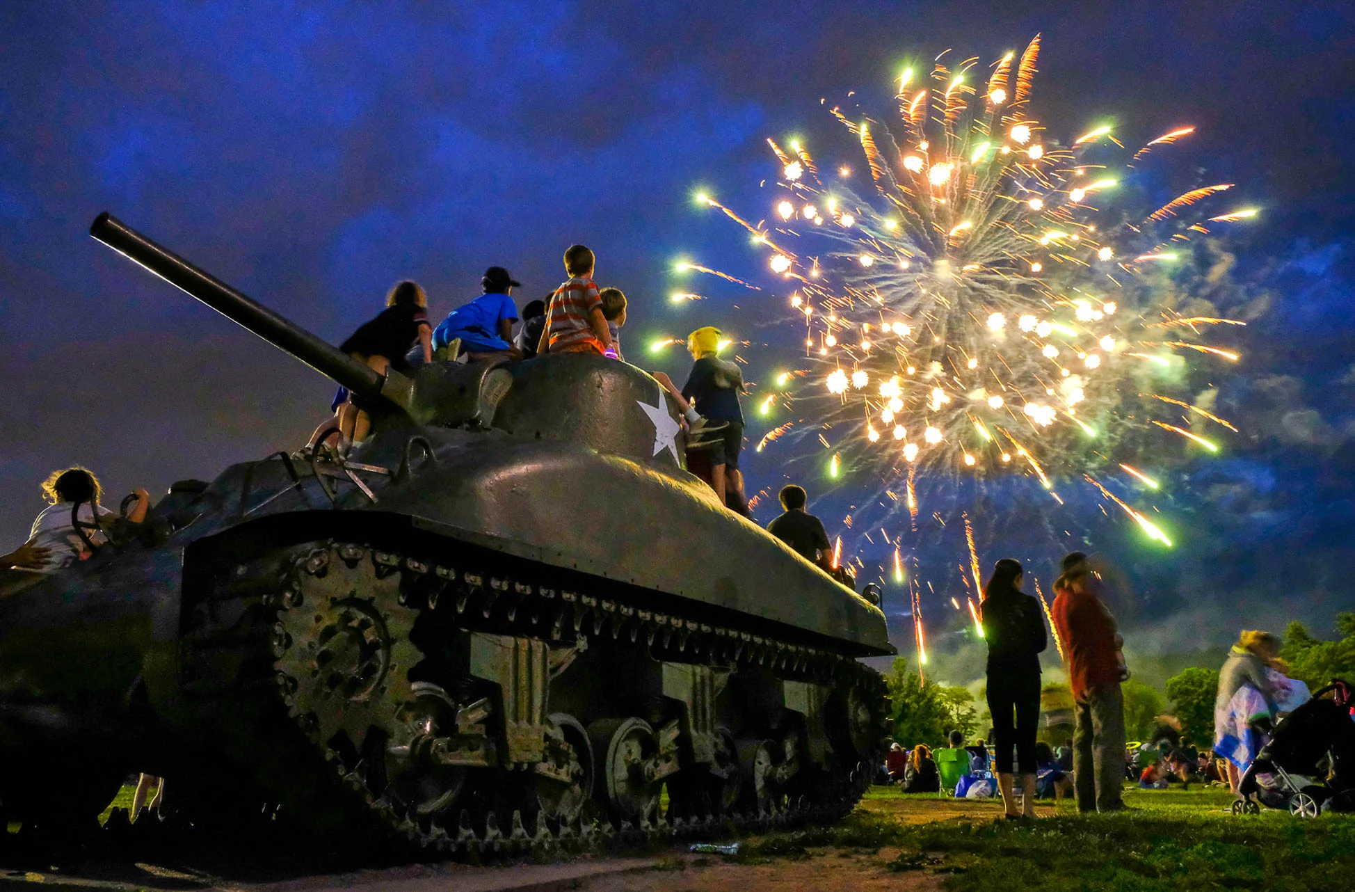 1st Place, News Feature Photo People enjoy a fireworks display and music at Patton Park in Hamilton at the conclusion of the Community Block Party, Sunday, June 25, 2017.