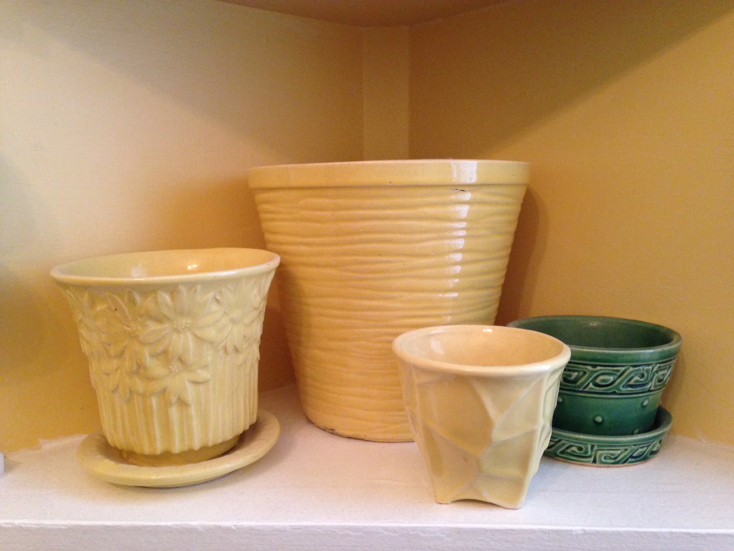 Grouping by color...well, except the loner green pot. &nbsp;I need to find it another home. &nbsp;But for now, this is the only place it will fit!