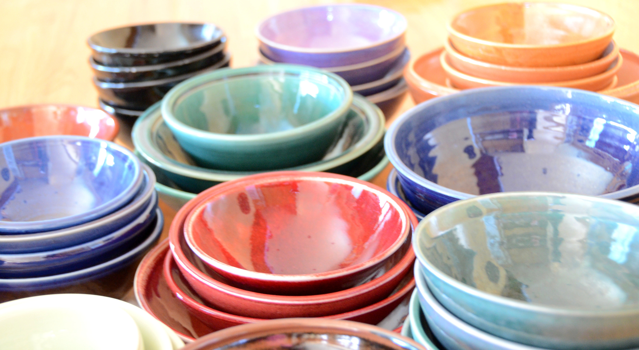 Porcelain Bowl Sets | Hand thrown porcelain on a potter's wheel.  High Fired, Cone 10, Assorted Colored Glazes, Hand Trimmed, Ceramic, Red, Green, Purple, Orange, Blue | Caldwell Pottery