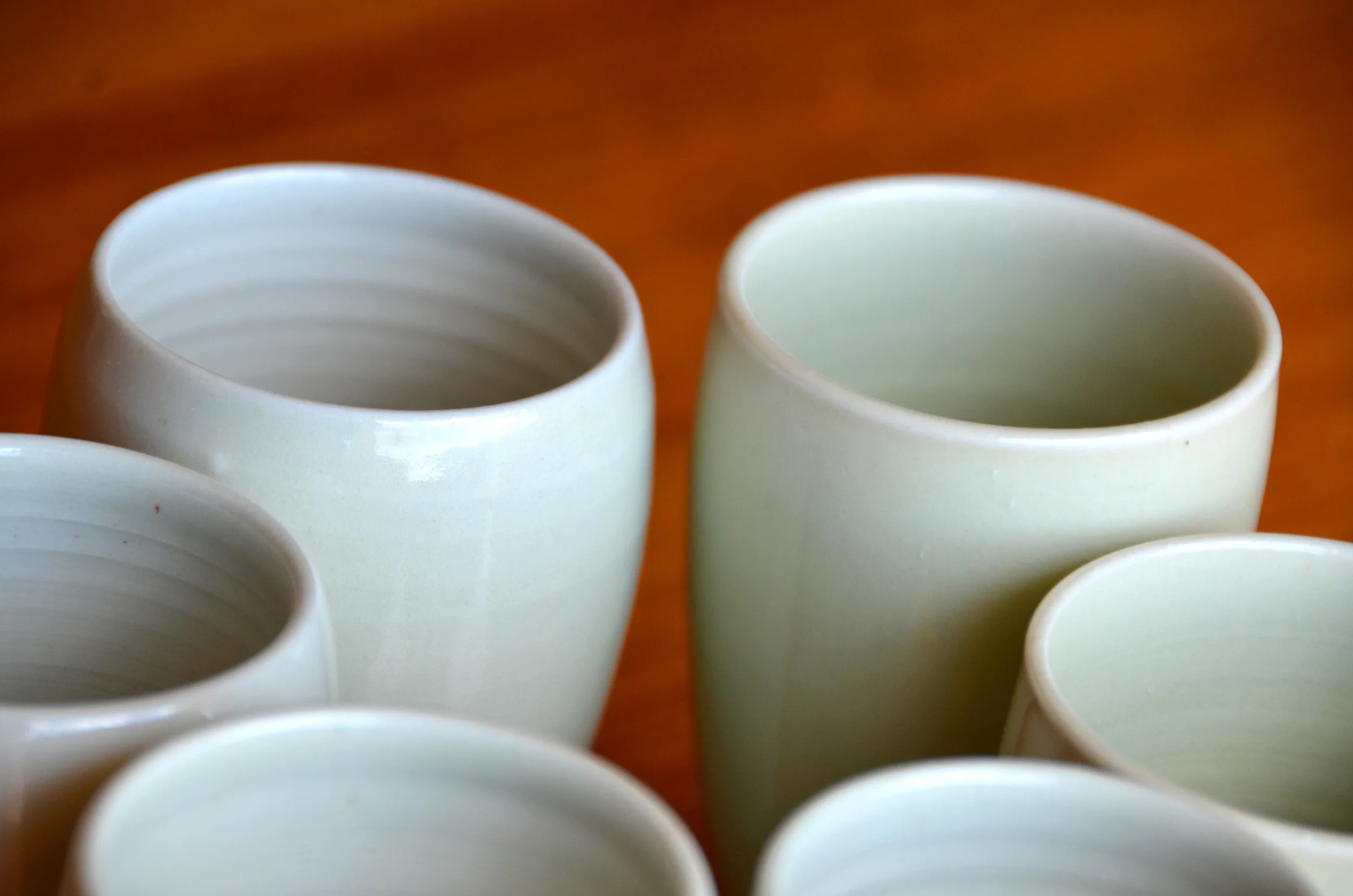 Porcelain White Handless Cup Set | Hand thrown porcelain on a potter's wheel. High Fired, Cone 10, Flambe Blue Glaze, Hand Trimmed, Ceramic | Caldwell Pottery