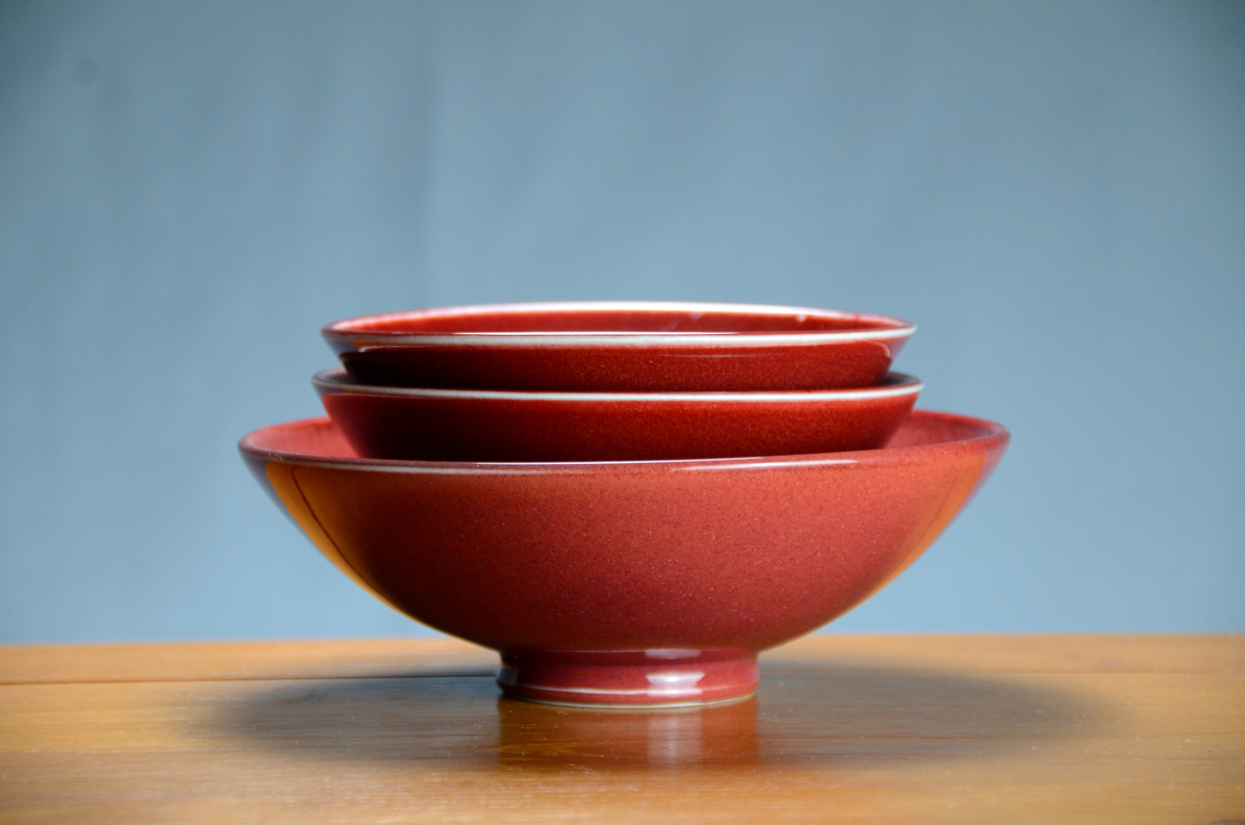 Porcelain Red Japanese Bowl Set | Hand thrown porcelain on a potter's wheel.  High Fired, Cone 10, Tom Coleman's Vegas Red Glaze, Hand Trimmed, Ceramic | Caldwell Pottery