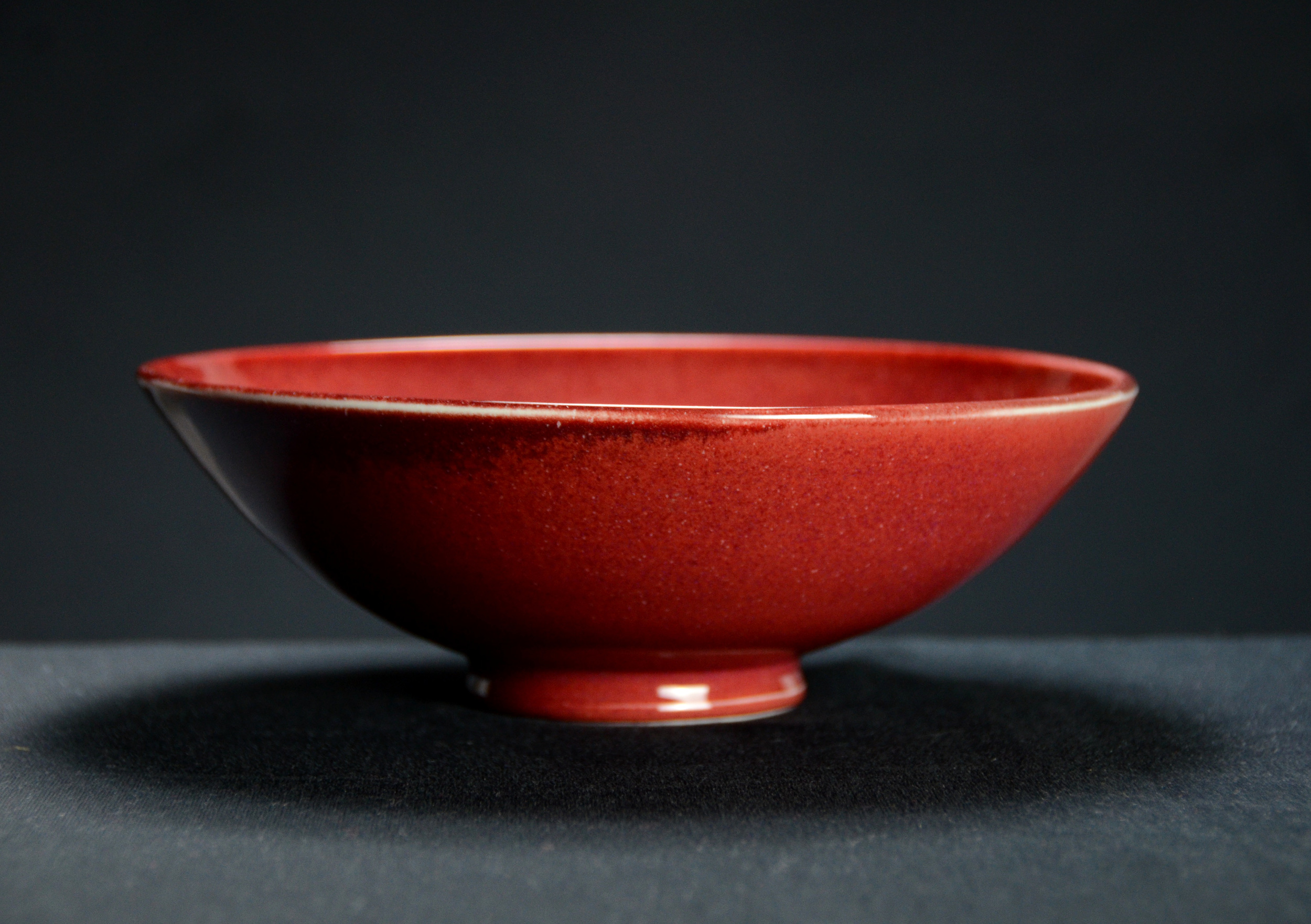 Porcelain Japanese Red Bowl | Hand thrown porcelain on a potter's wheel.  High Fired, Cone 10, Vegas Red Glaze, Hand Trimmed, Ceramic | Caldwell Pottery