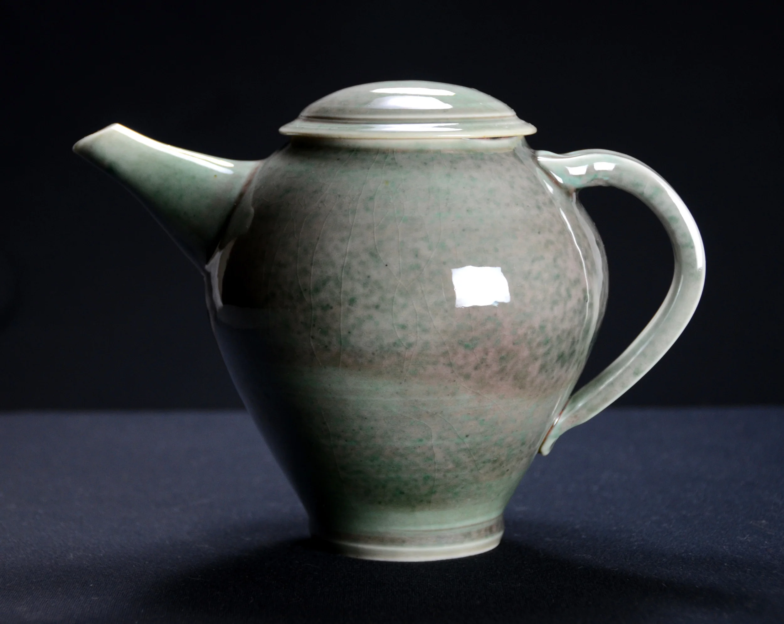 Porcelain Green Teapot | Hand thrown porcelain on a potter's wheel. High Fired, Cone 10, Copper Teal Green Glaze, Hand Trimmed, Ceramic | Caldwell Pottery