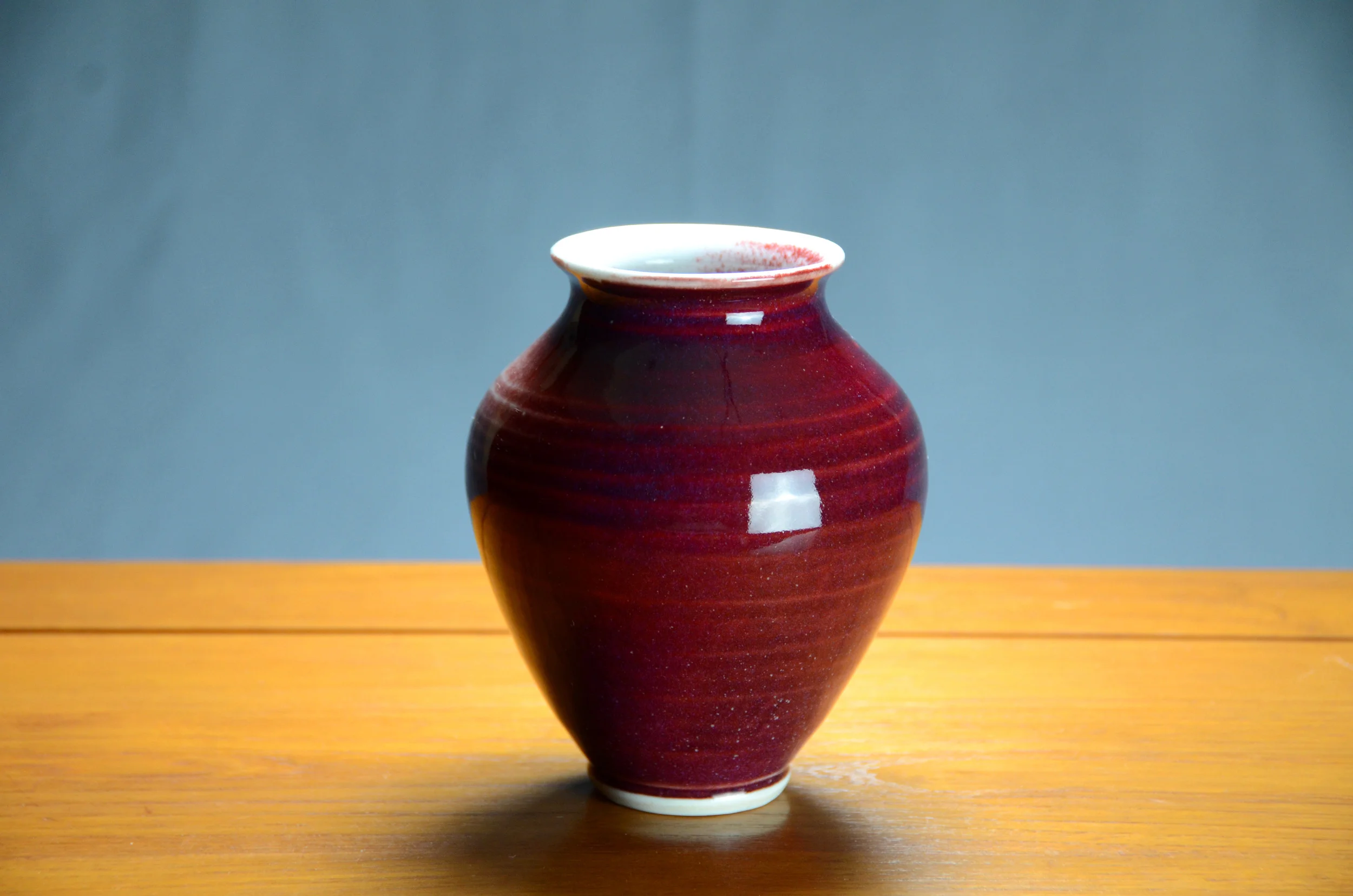 Porcelain Red Vase | Hand thrown porcelain on a potter's wheel. High Fired, Cone 10, Vegas Red & Lipstick Purple Glazes, Hand Trimmed, Ceramic | Caldwell Pottery