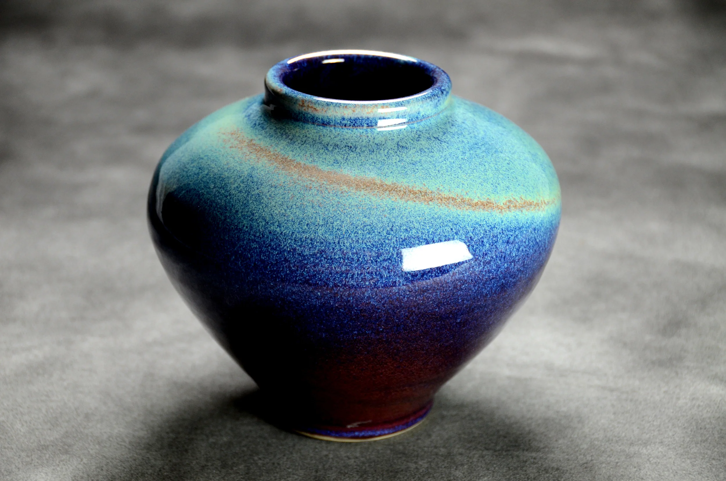 Porcelain Blue and Teal Vase | Hand thrown porcelain on a potter's wheel. High Fired, Cone 10, Flambe Blue Glaze with Rutile Glaze , Hand Trimmed, Ceramic | Caldwell Pottery