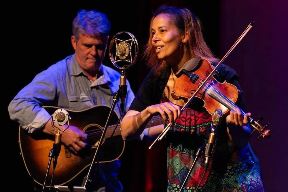 Rhiannon Giddens playing fiddle into Myrtle microphone