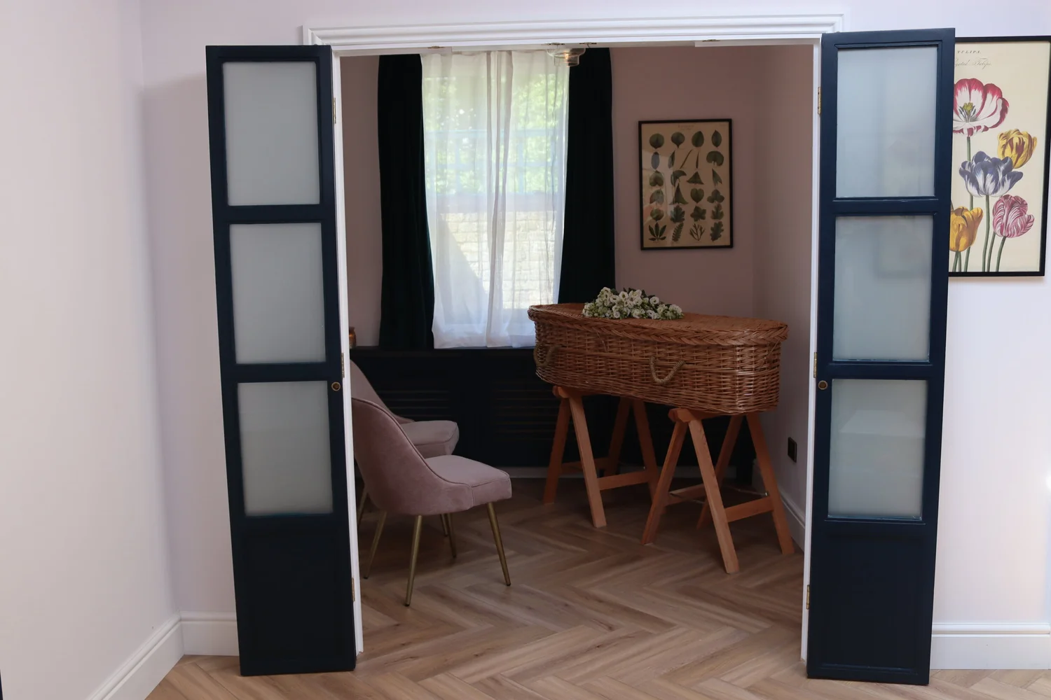 Open blue doors leading into the chapel of rest at Poetic Endings in Forest Hill