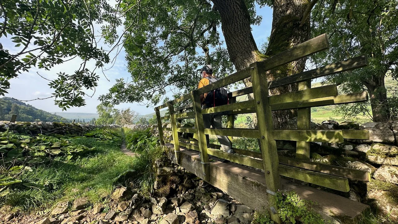  Entering more wooded areas. It was nice to have a bit of shade. Cute little bridge. 