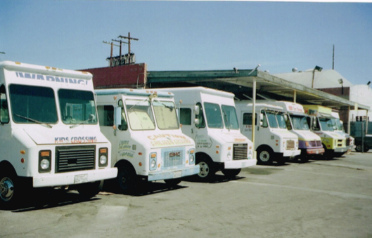 Ice cream trucks all lined up, waiting to delight children up and down the Los Angeles hills. Shot on 35mm. 