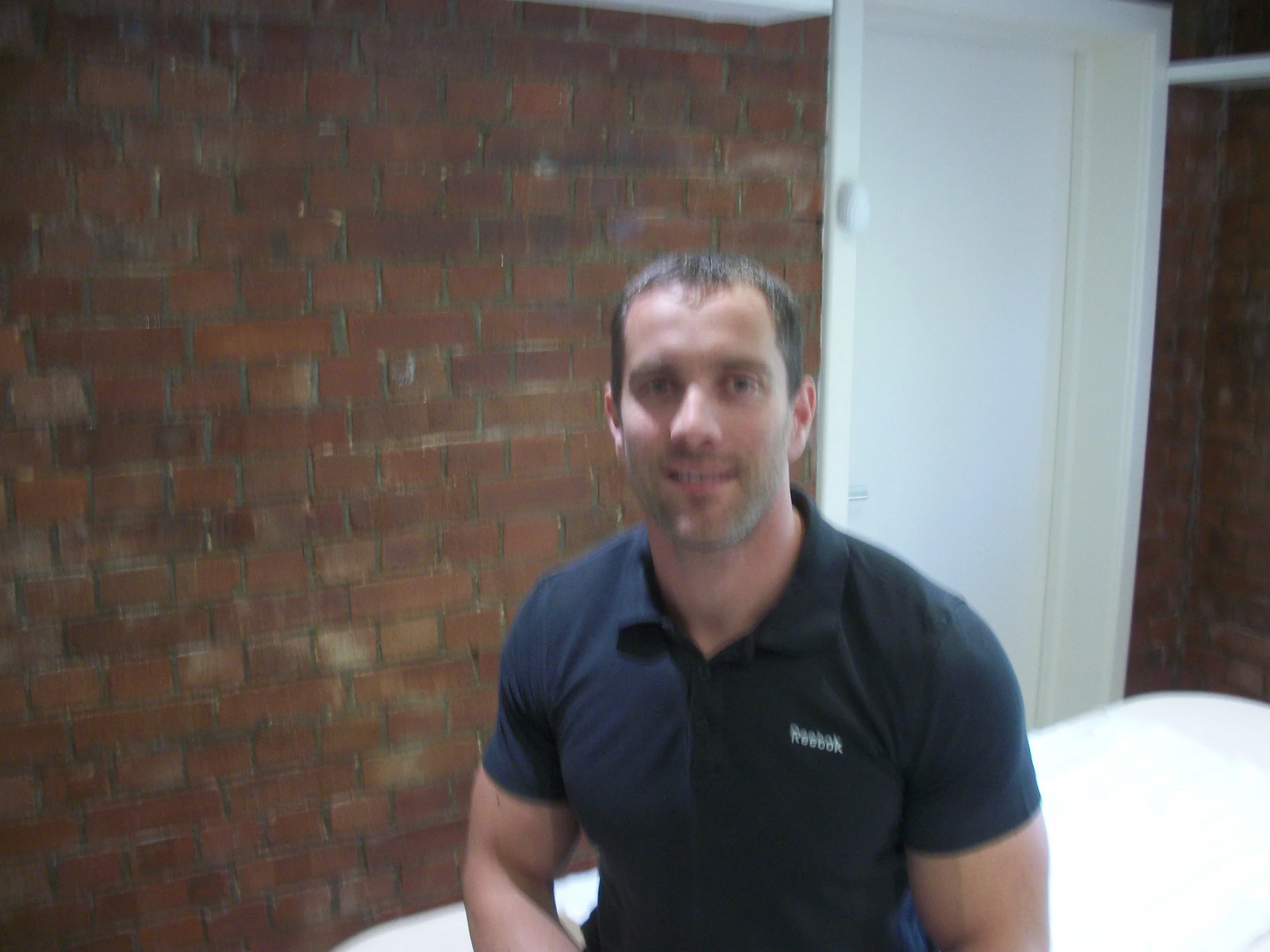 Male massage therapist masseur sports massage full body