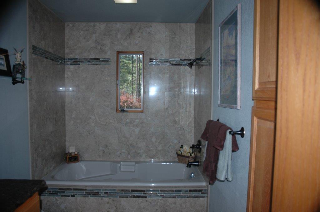 bathroom remodel with tile and tile border.jpeg