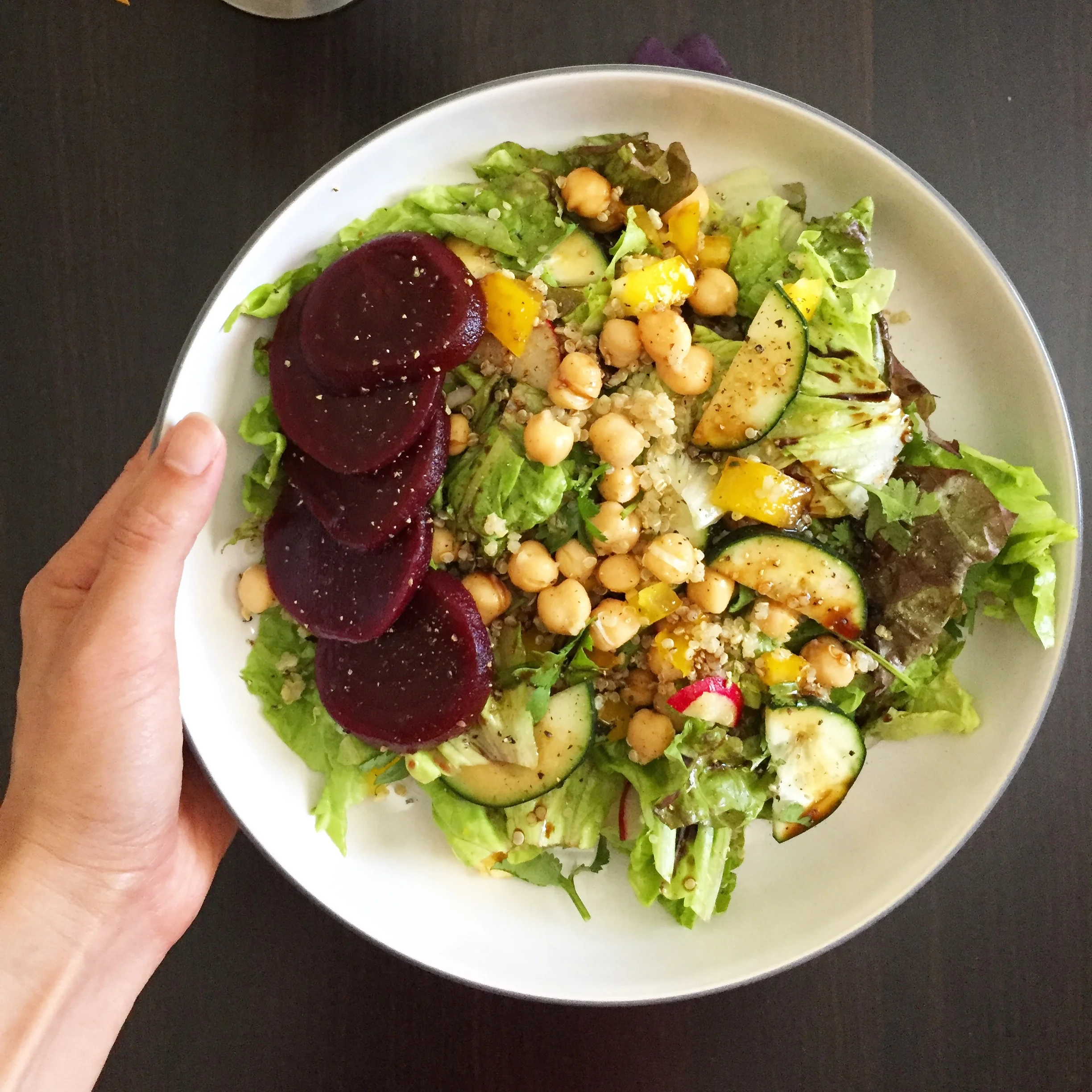 Lunch Chickpea salad with beets, cucumbers, quinoa, yellow bell peppers, radishes. Drizzled with fig balsamic vinegar.