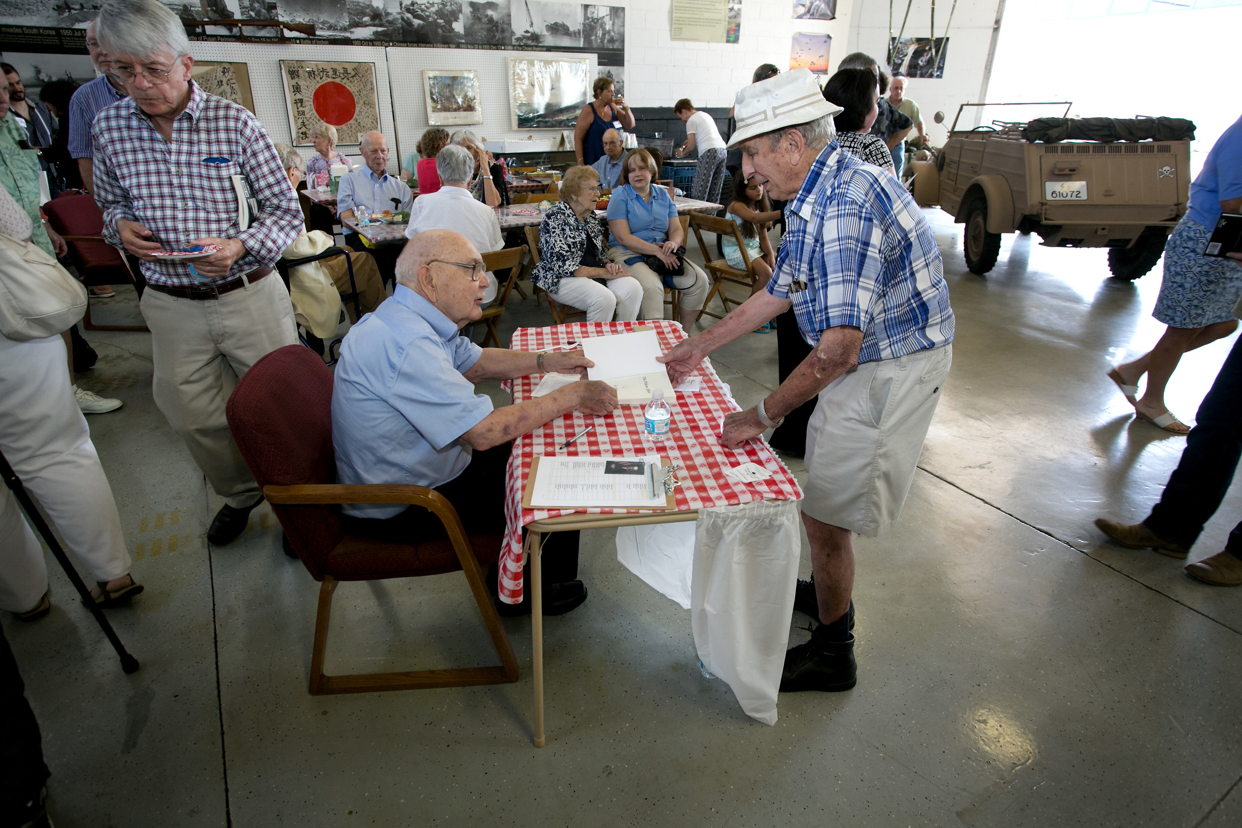 Bob signs a book for Andy from Sr Ctr.jpg