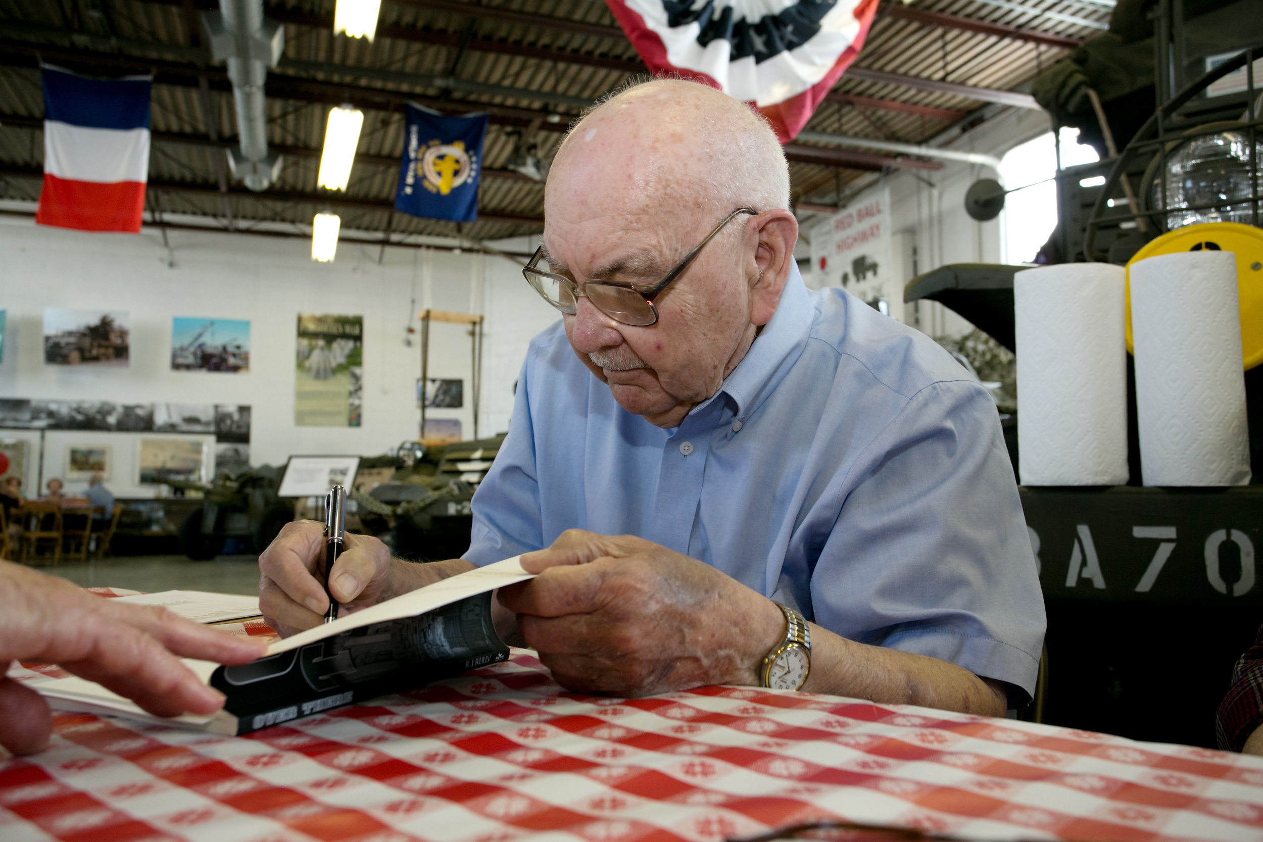 Closeup Bob signing book.jpg