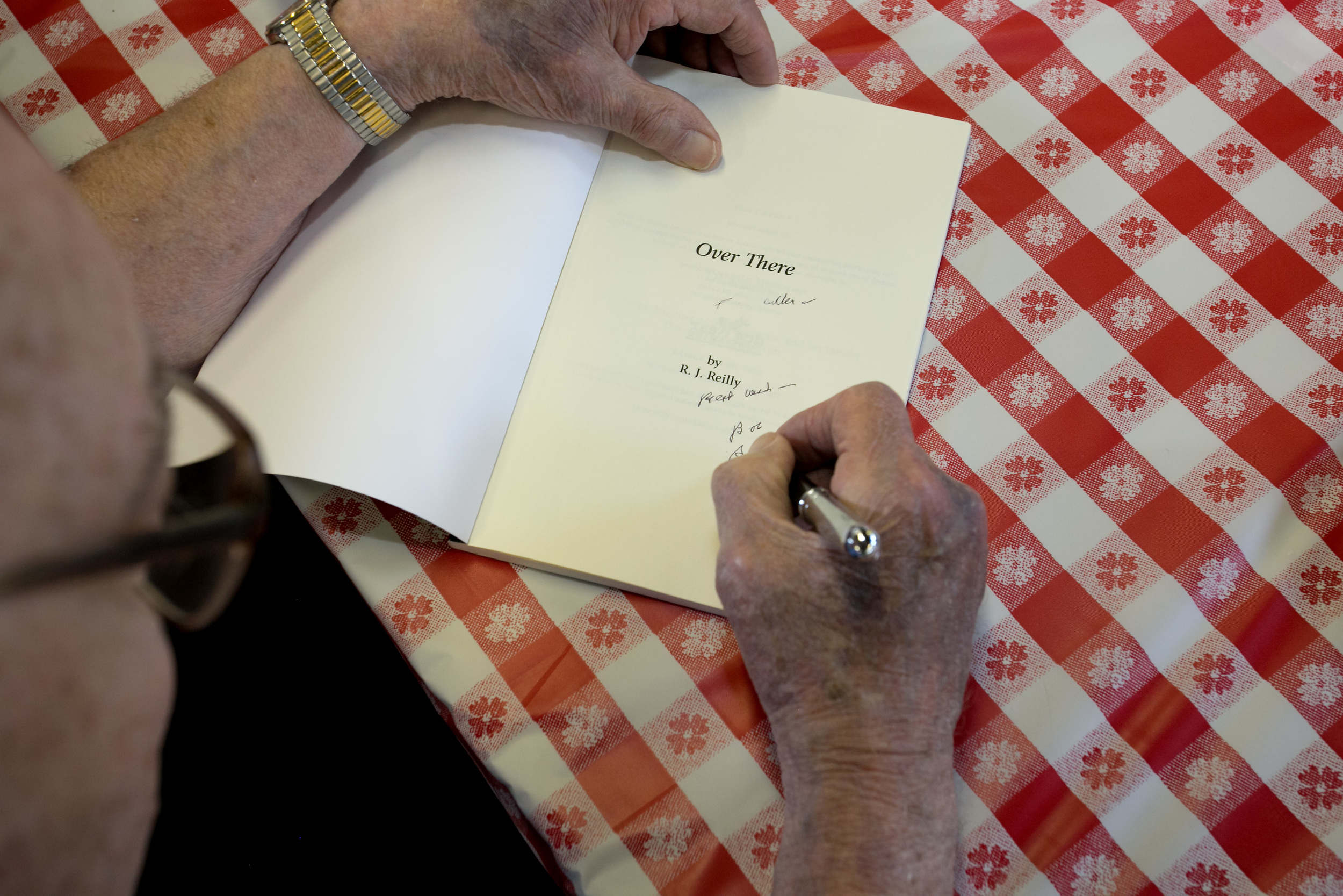 Bob signing a book.jpg