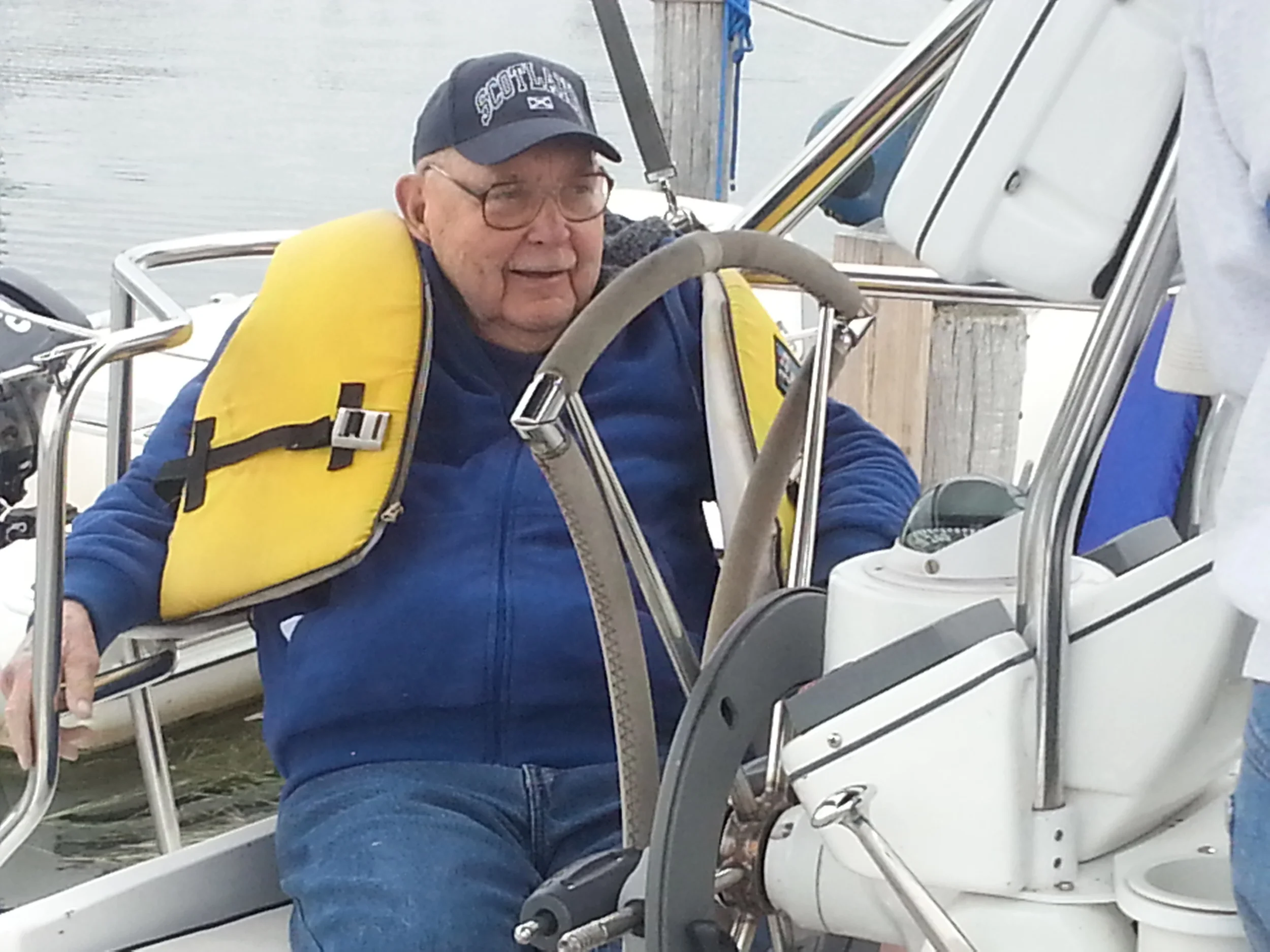 R. J. Reilly relaxes with friends during a late summer sail on Lake St. Clair near his home.