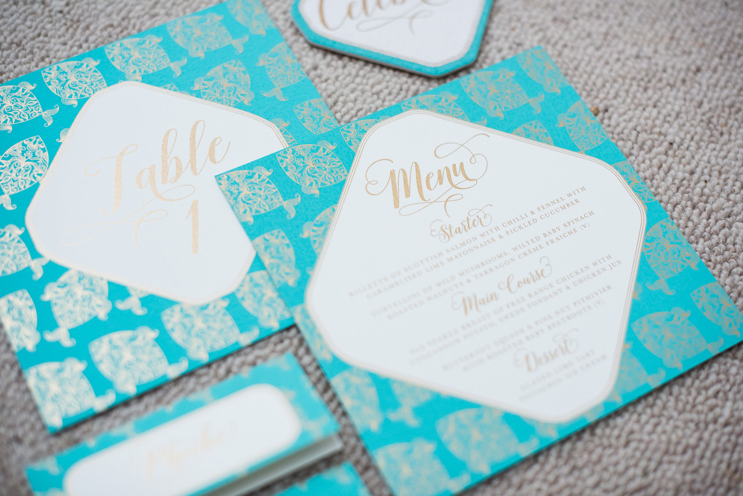 trio-of-life-fish-blue-menu-table-number-wedding-invitation.jpg