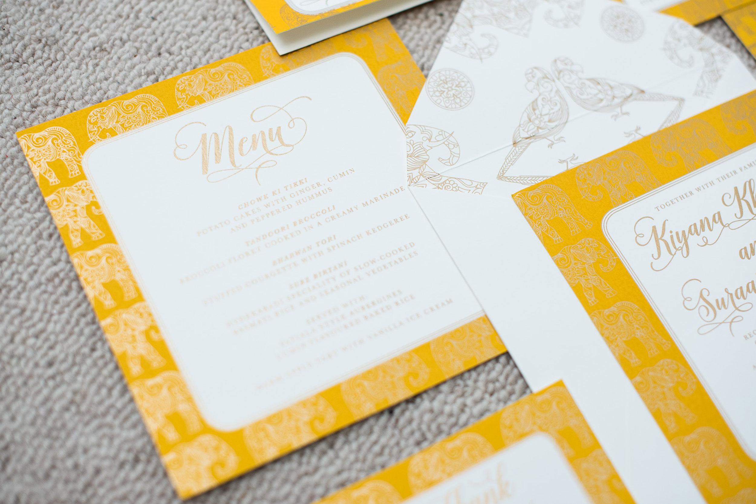 trio-of-life-gold-elephant-menu-wedding-invitation.jpg