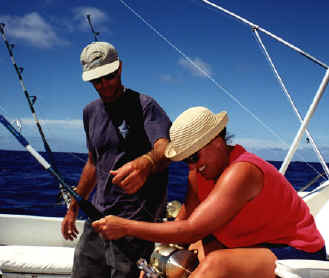Here, the crew assists with the fishing rod