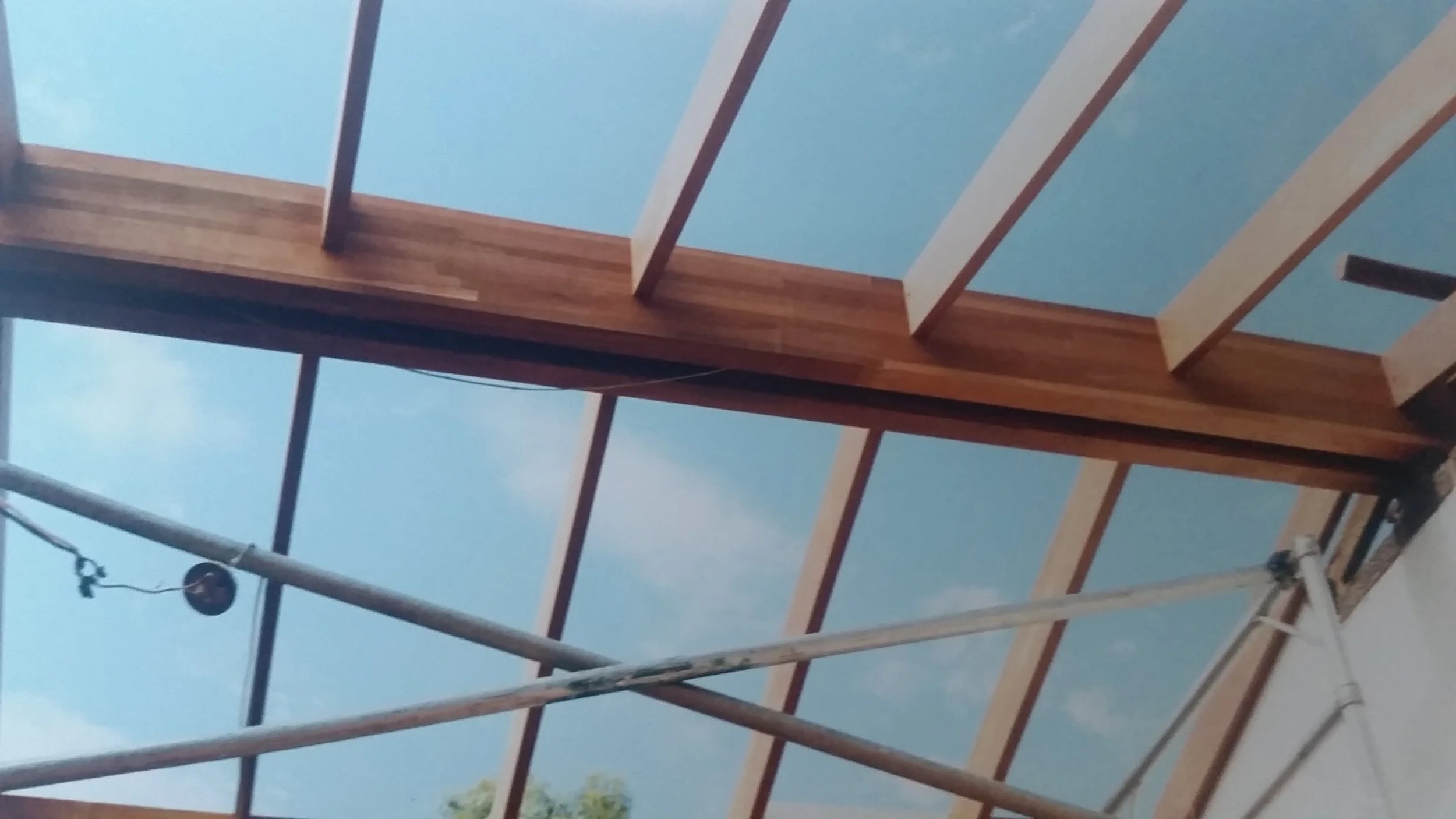 Old plasterboard ceiling and roof beams removed, new twin exposed laminated jarrah main beams and rafters fitted.