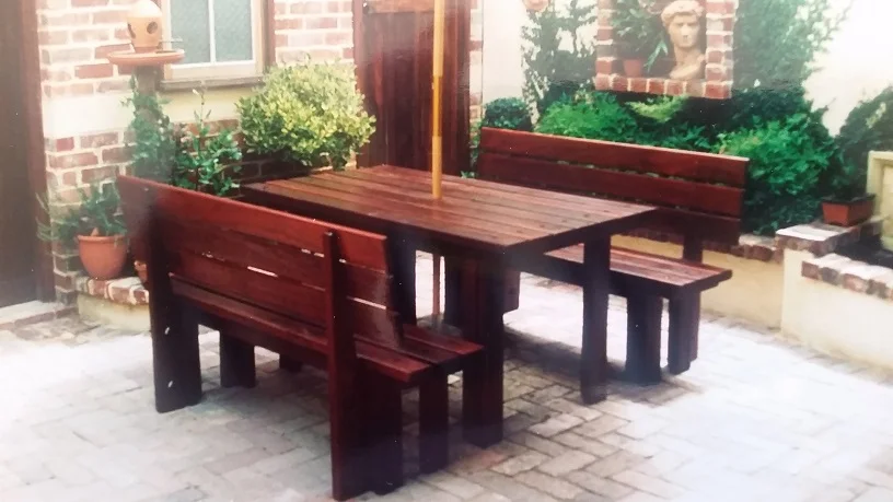 Rustic outdoor furniture in a city setting.