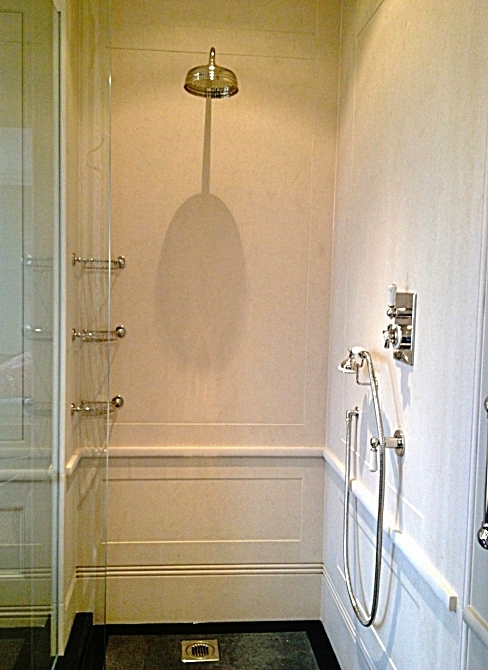 20. Limestone installed for showers with panelling detail to replicate joinery