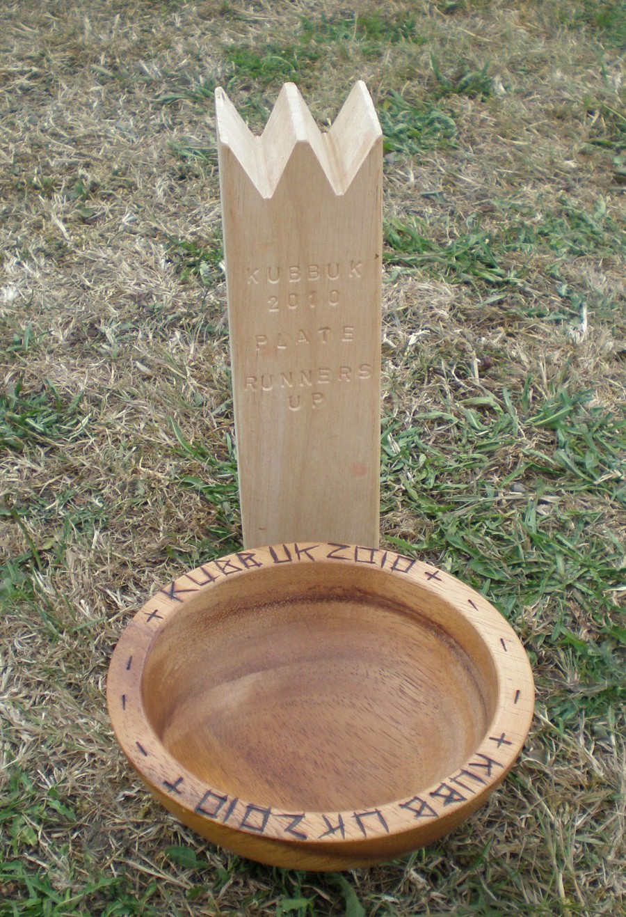  The desirable plate and runners up trophy. 