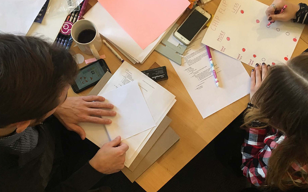 A rapid prototyping session where the entire team created mock "Quests" out of basic art supplies.