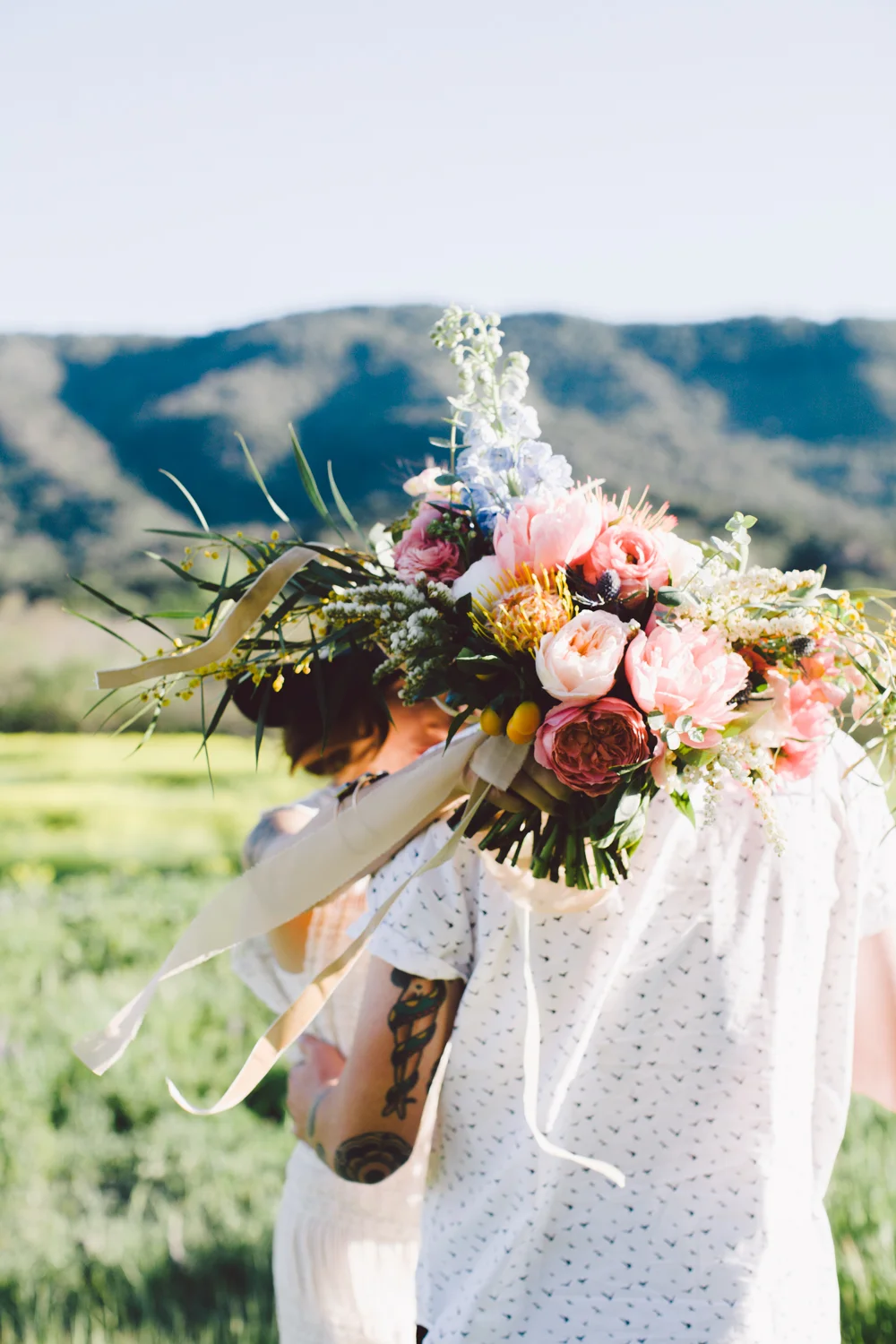 Tattooed Groom. Non-traditional elopement. Spring Bloom Boho Elopement Wedding Portraits Ojai, California. Wild Wedding Bouquet. Planning & Design Art & Soul Events. Photo, Evangeline Lane