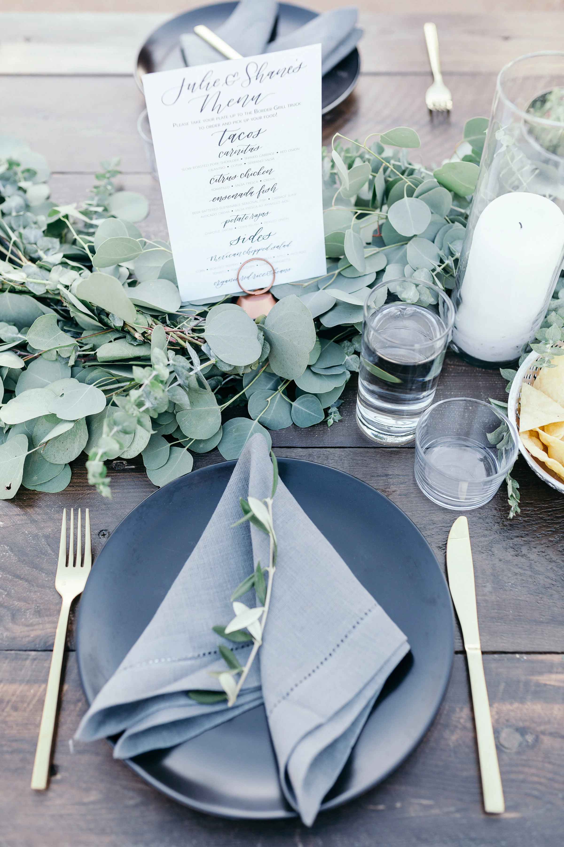 Bohemian Wedding, Black plate, grey napkin, gold flatware, garland, Rimrock Ranch Desert Wedding Venue, Pioneertown, California, Art & Soul Events, Kiel Rucker Photography
