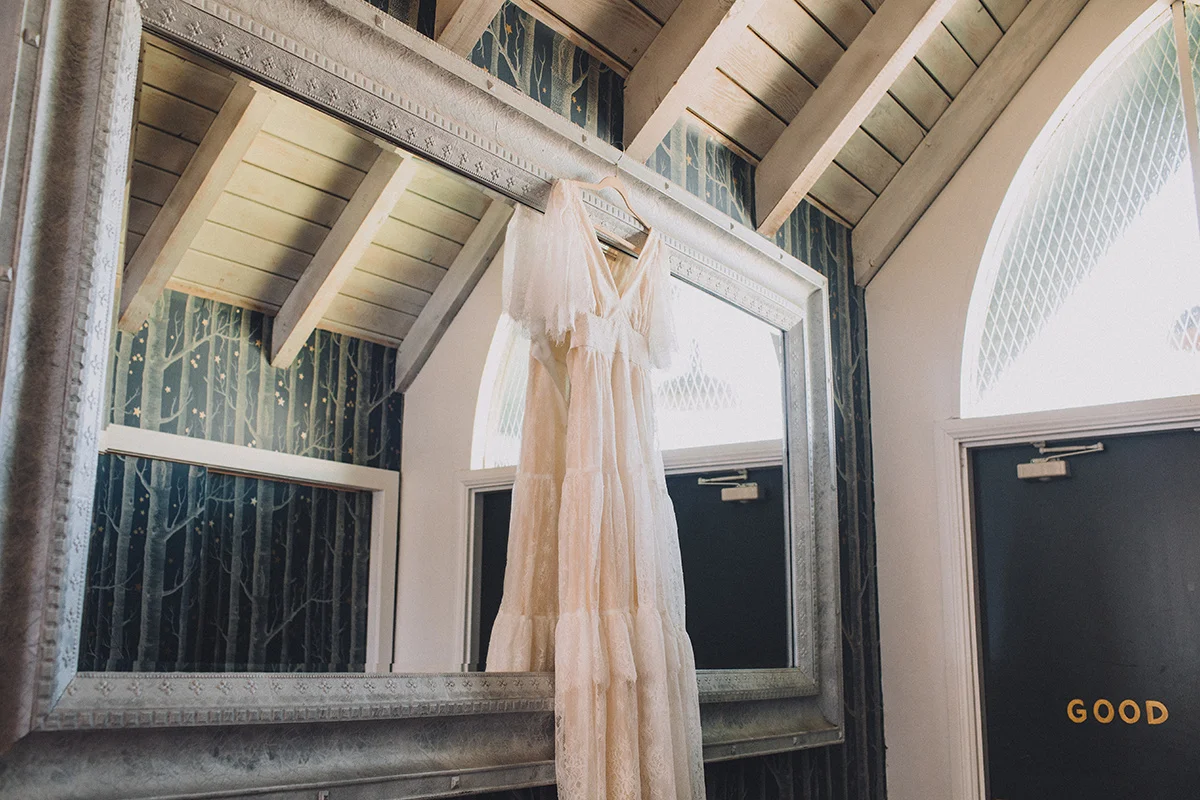 Ruby Street Wedding, Wedding Dress hanging on a mirror, Art & Soul Events, Mandee Johnson Photography