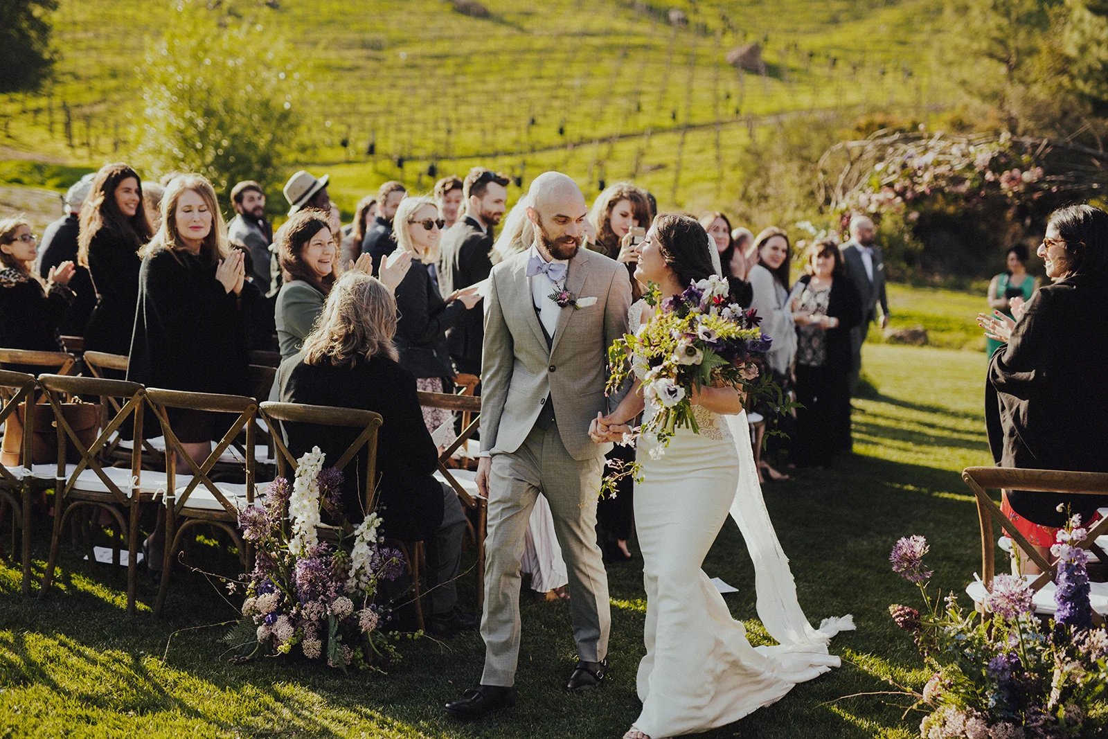 Bride and Groom Recessional at Saddlerock Ranch Camp Cabernet Malibu Winery Wedding Venue, Aisle Floral Pieces, Planned by Art & Soul Events