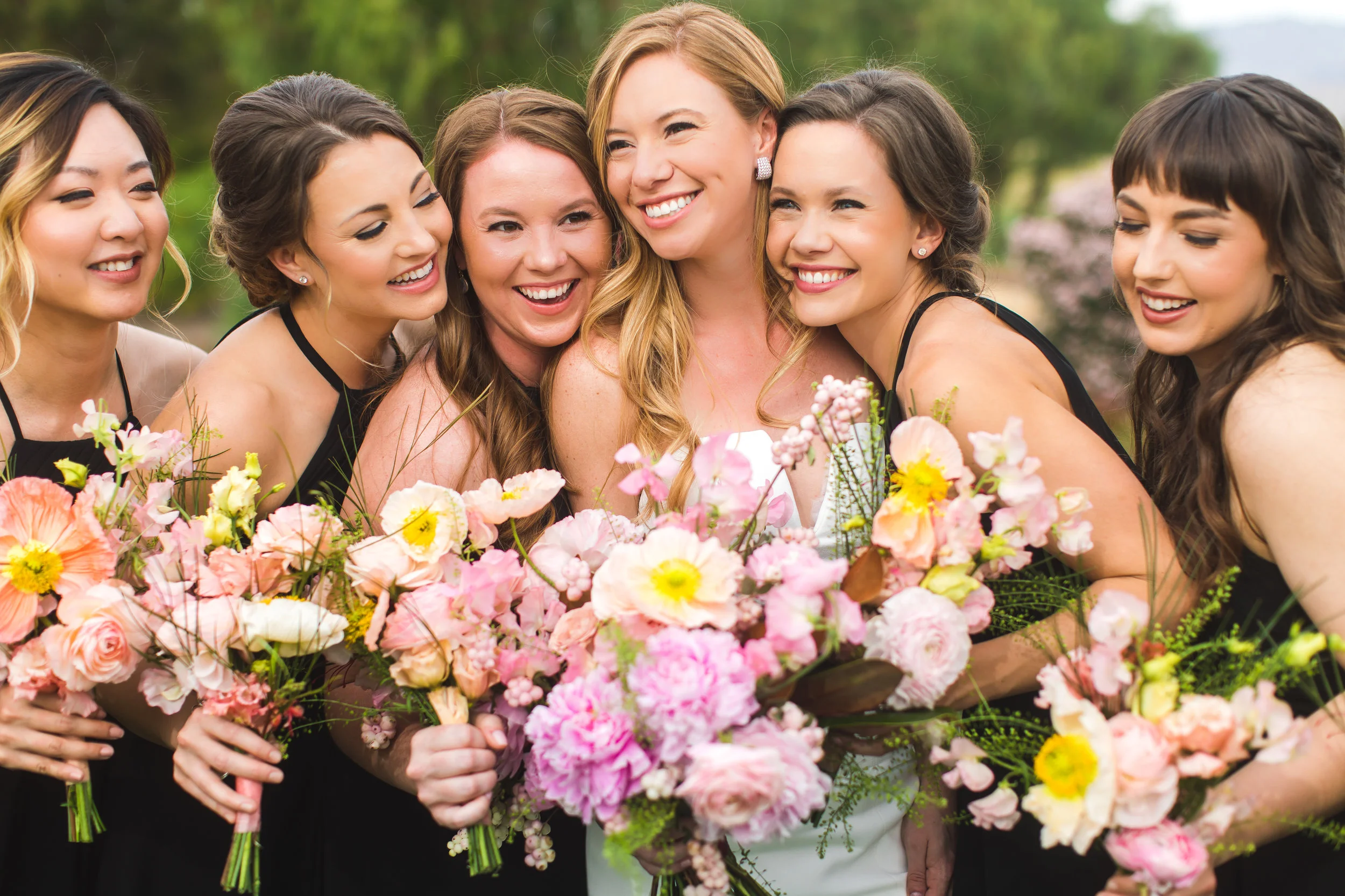 black-bridesmaids-dresses-pink-yellow-wedding-bouquets.jpg