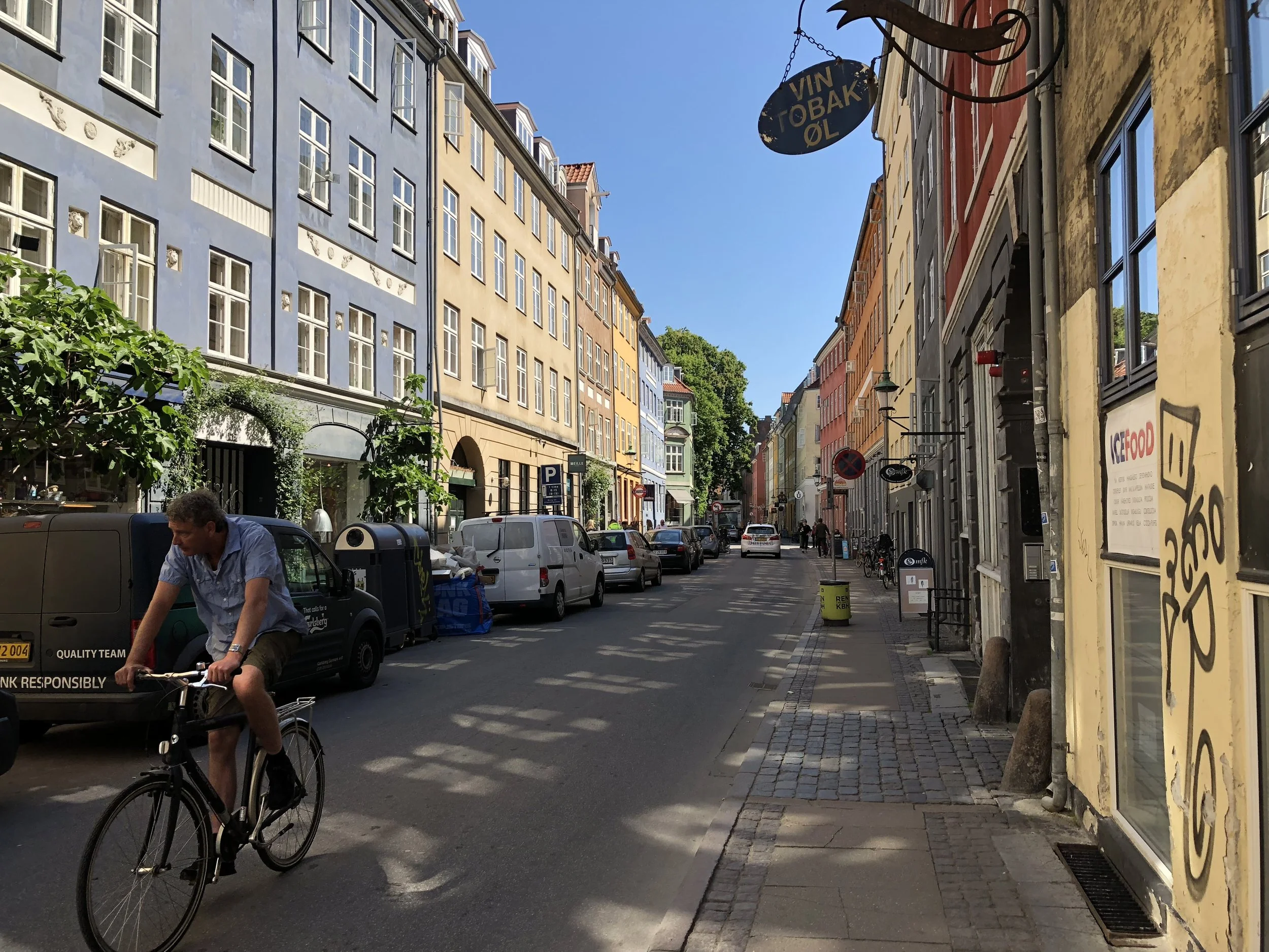 A high density street in Copenhagen, Denmark is quiet, correctly illuminated, and minimizes pollution and noise nuisances of cars. 