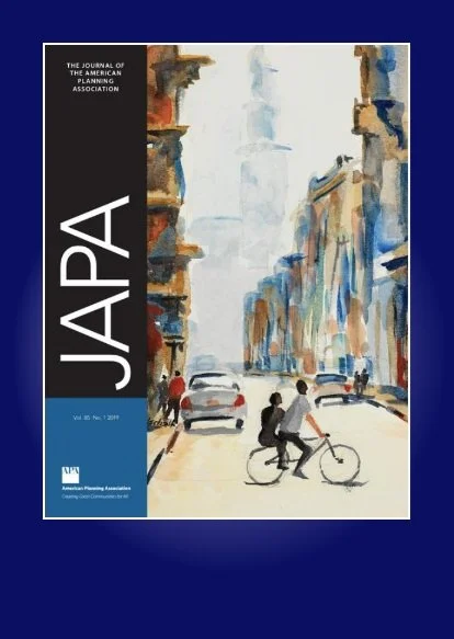 Cover of The Journal of the American Planning Association, featuring a watercolor illustration of a city street with buildings, cars, and two people riding a bicycle.