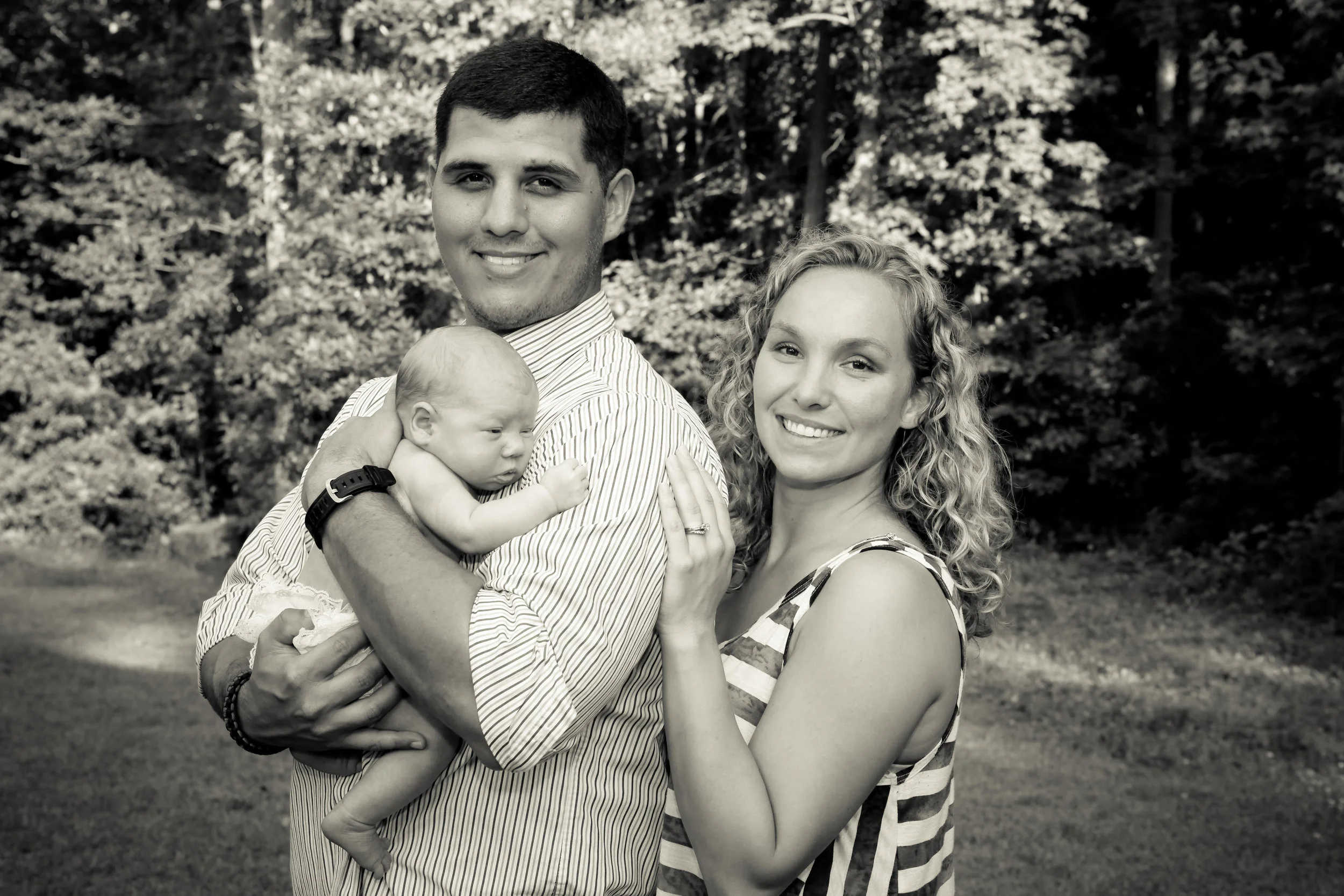 Courtney Gomez - founder of Seaside Doulas with her husband and baby