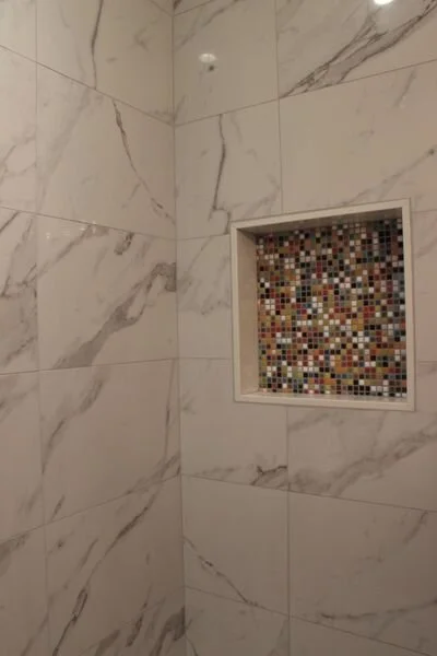 Bryant_renovations_bathroom_renovation_funky_tiled_recessed_shower_shelf.jpeg