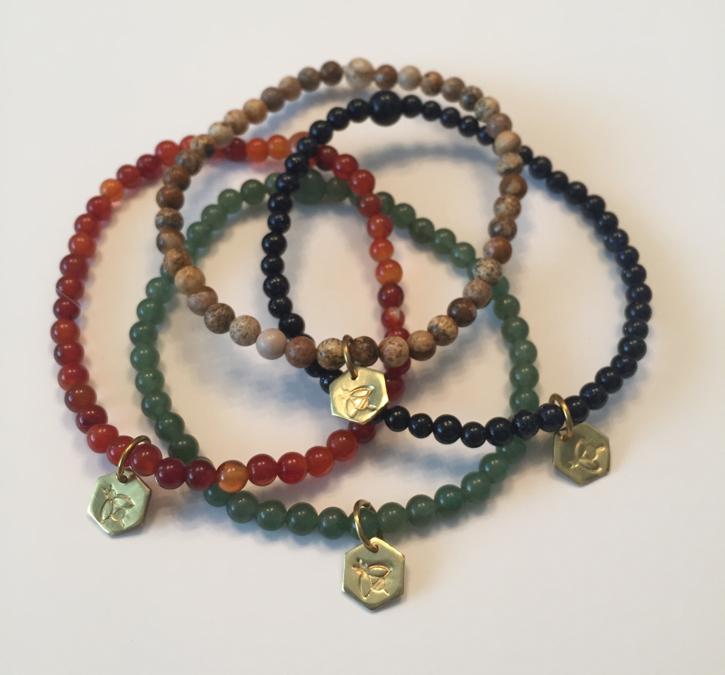The hexagon symbolizes our love for nature, positive change, our love for the bees & their gifts. 