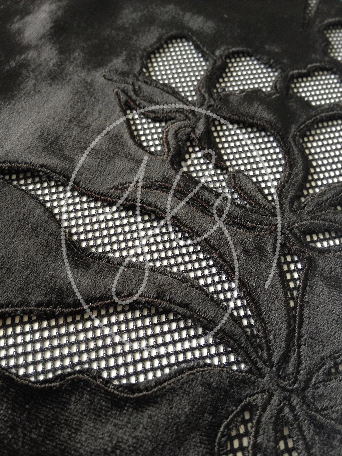 GRAPHIC CUTWORK Traditional floral translated using cutwork on velvet.