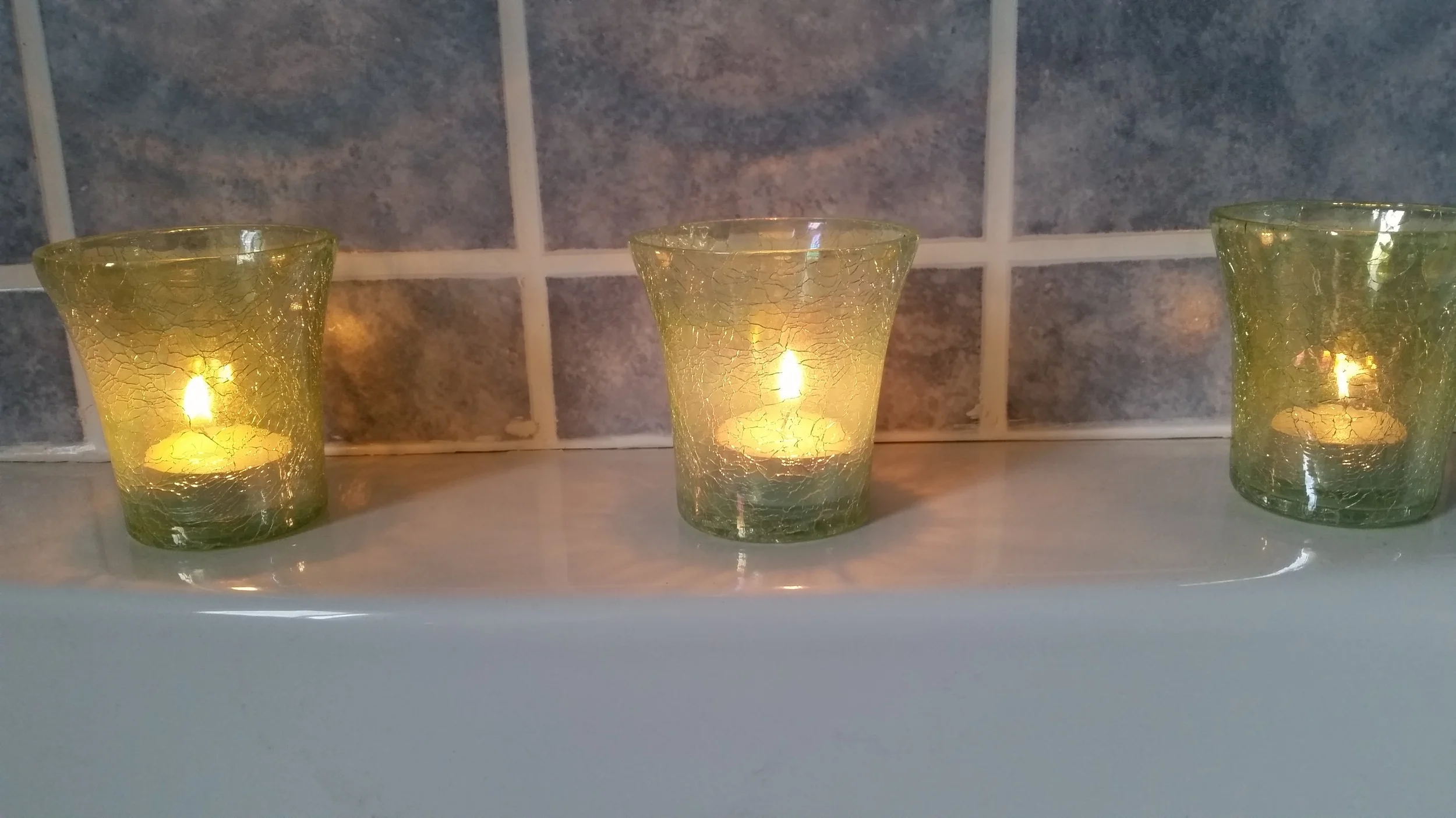 Three candles in the washroom