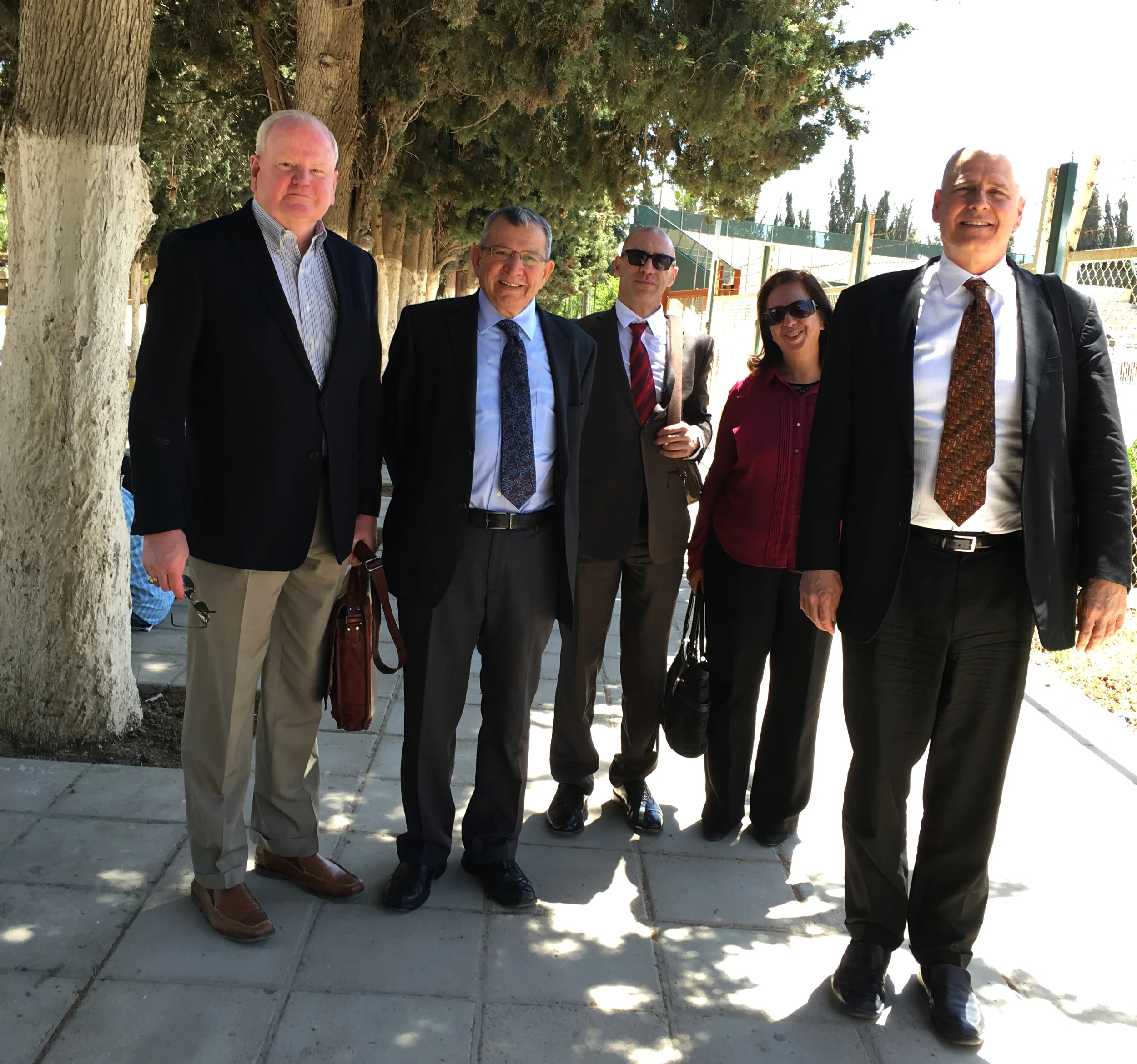 Maj Gen (Ret) Charles E. Tucker, Dr. Mahmoud Duwairi, Craig Coletta, Sawsan Alfayez, and Dr. Eric Woltertorff on the University of Jordan campus.