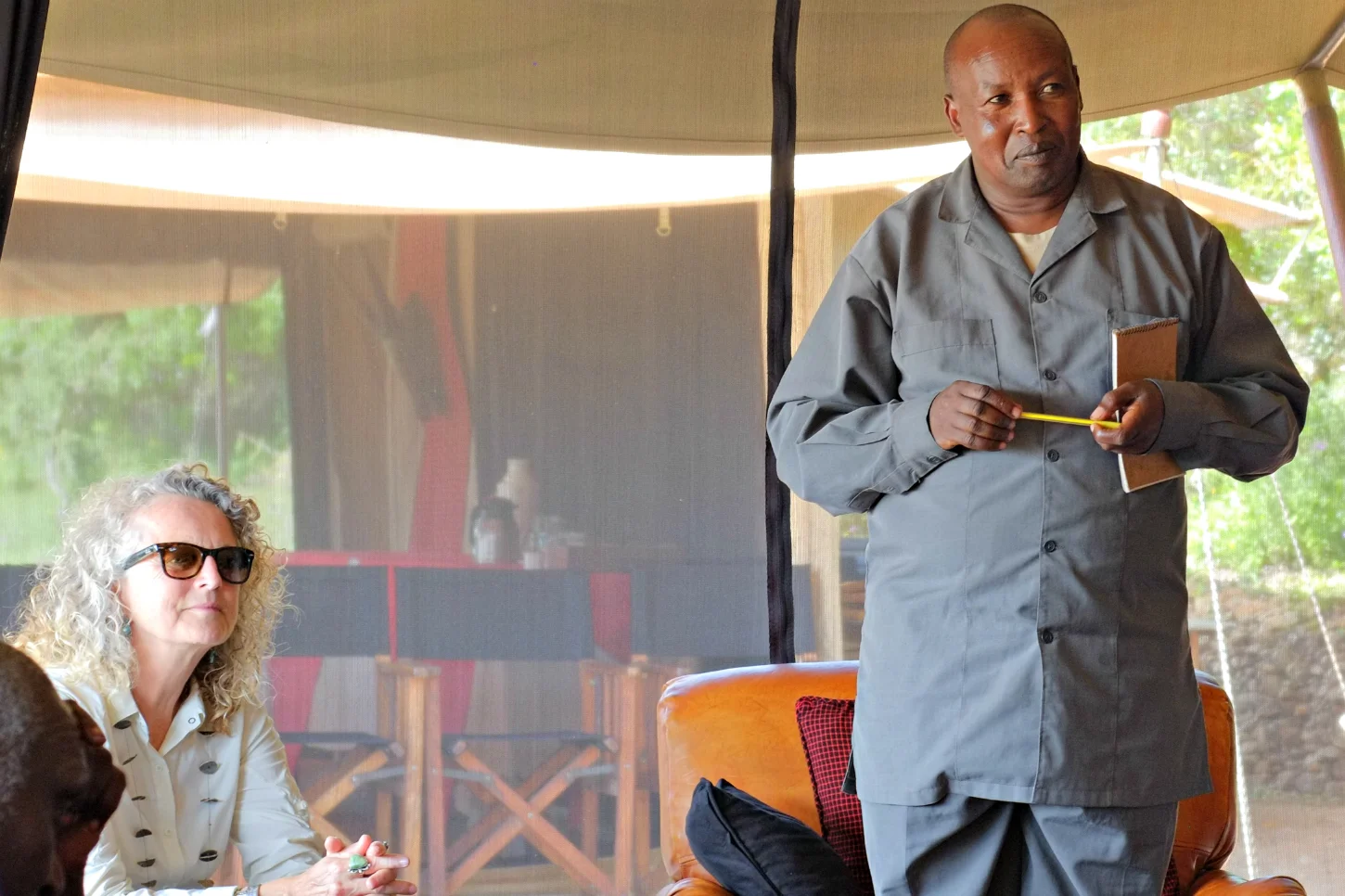 William Alais, Oloipiri Ward Councilor, and Judi Wineland, FoTZC Director, listening to the concerns of local elders.
