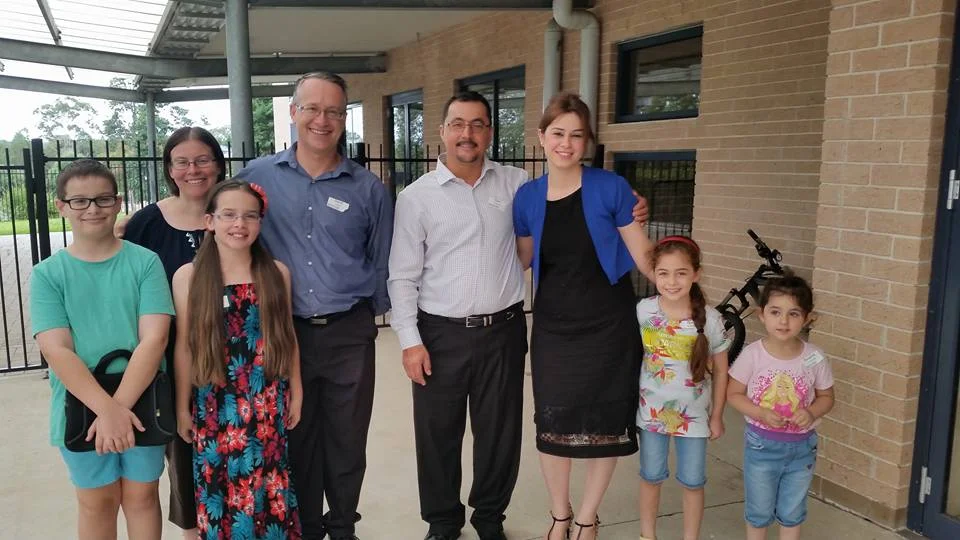 Grant recipients at Hoxton Park Anglican Church_Rev David Clarke, Senior Minister, with wife Janine and their children, and Pastor Sami Youkhana, Pastor of the Arabic congregation, with his wife Sarah and their children.jpg