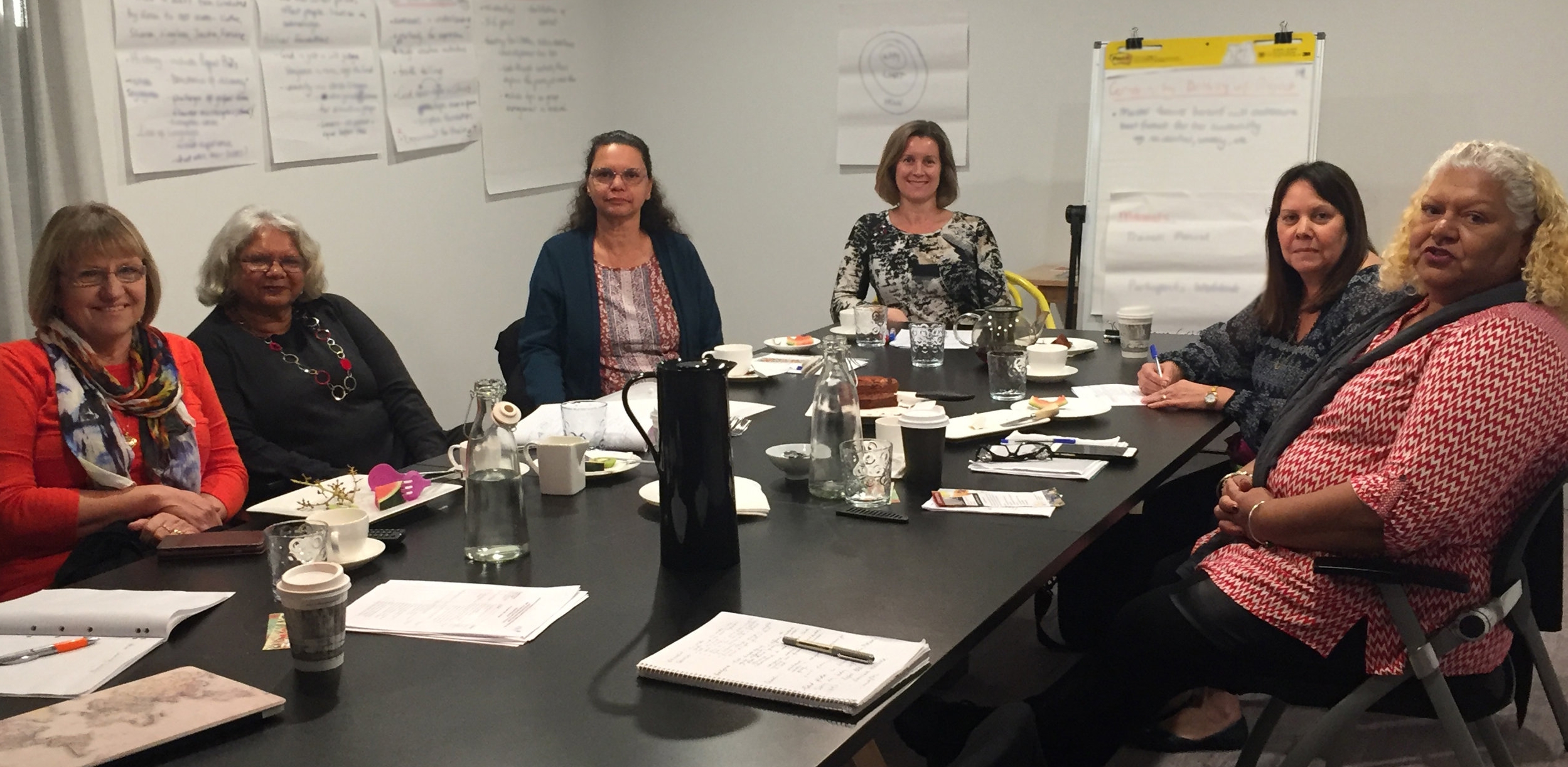 Women from AEF and ADM work on the developing the pilot project.