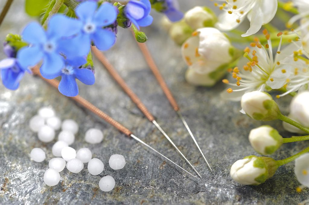 alternative medicine with pills and acupuncture