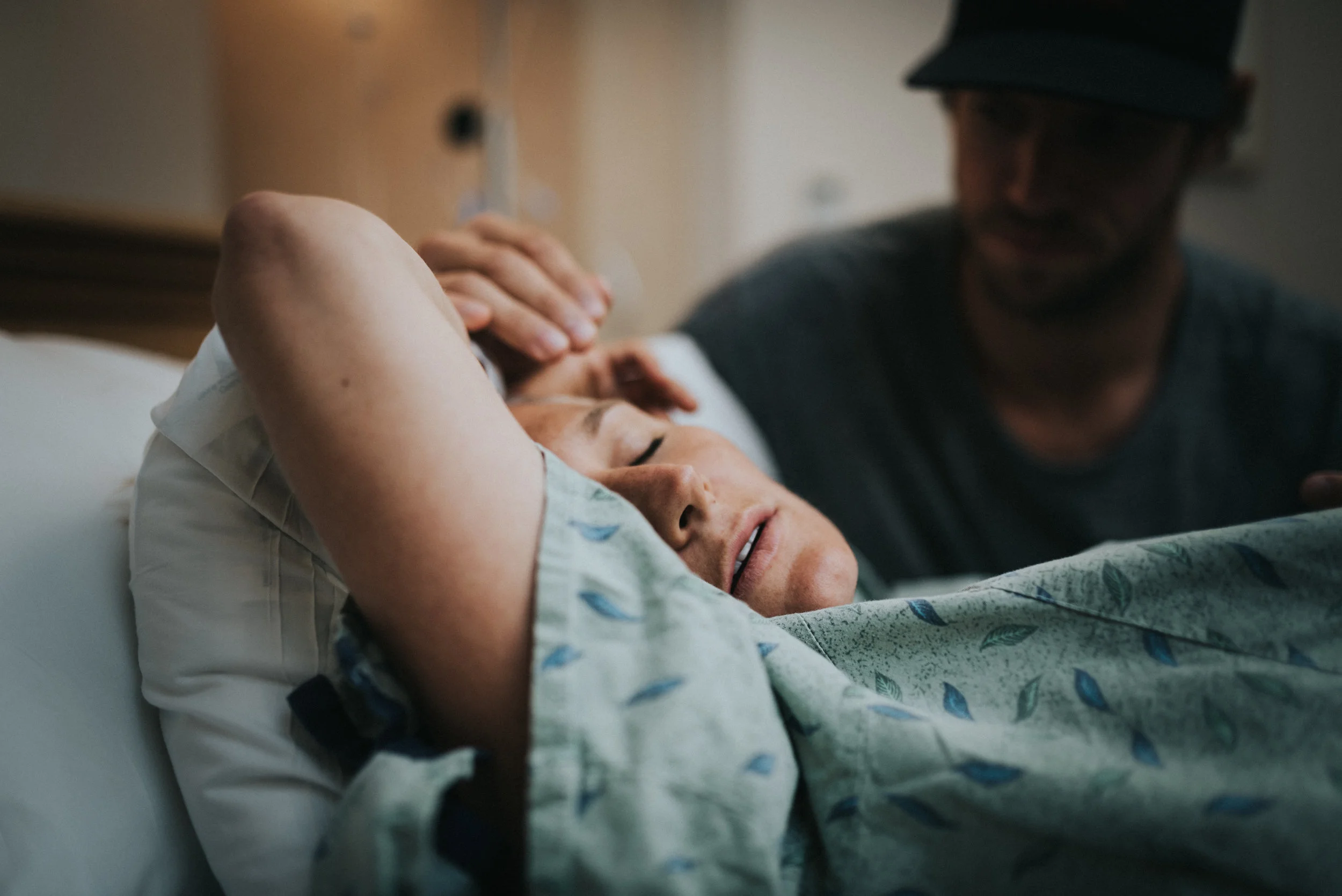 A mother enduring contractions during labor at Scottsdale Shea Hospital.
