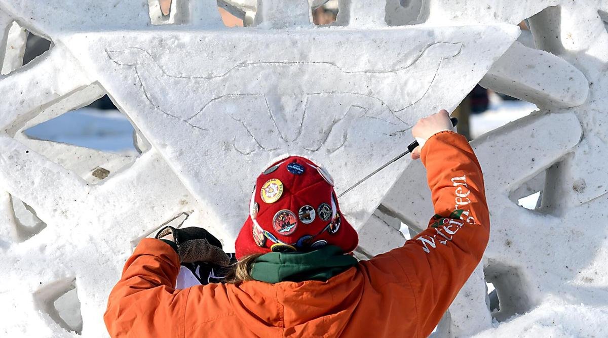  ”PHOTOS: Snow sculptors create giant snowflake at MSU”, Photos by Pat Christman https://www.mankatofreepress.com/multimedia/photos/photos-snow-sculptors-create-giant-snowflake-at-msu/collection_2b0114fe-6636-11eb-8491-efe7b5ae44f6.html#anchor_item_1